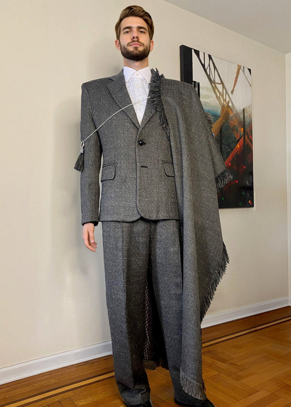 Stacy Stewart Smith Men's Diamond Dodger Tailored 3-Piece Tweed Suit on a mannequin 6'3" front view in a room with an antique white wall, wooden floor and oil painting by the designer.