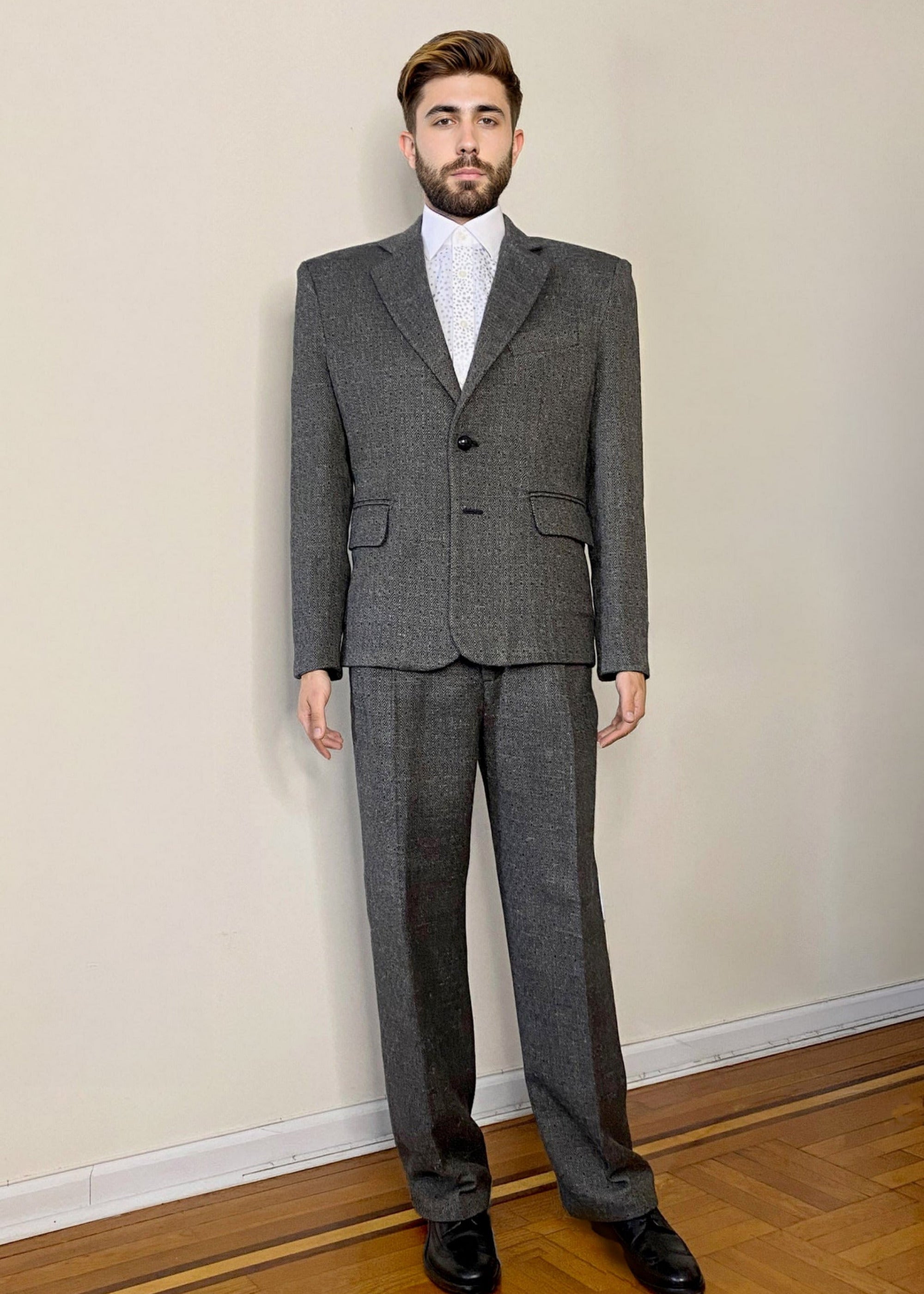 Stacy Stewart Smith Men's Diamond Dodger Tailored 3-Piece Tweed Suit on a mannequin 6'3" front view w/o cloke in a room with an antique white wall, wooden floor.