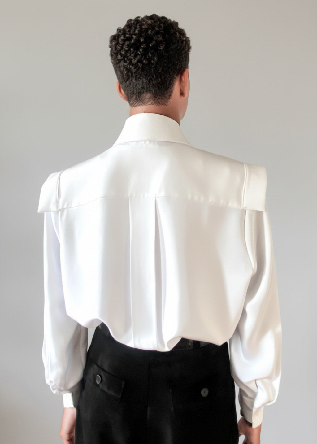 Stacy Stewart Smith Men's Poet Laureate White Silk Crepe Shirt on mannequin 6'3" without jabot-with black suede Windsor pants back view tucked in against a gray backdrop