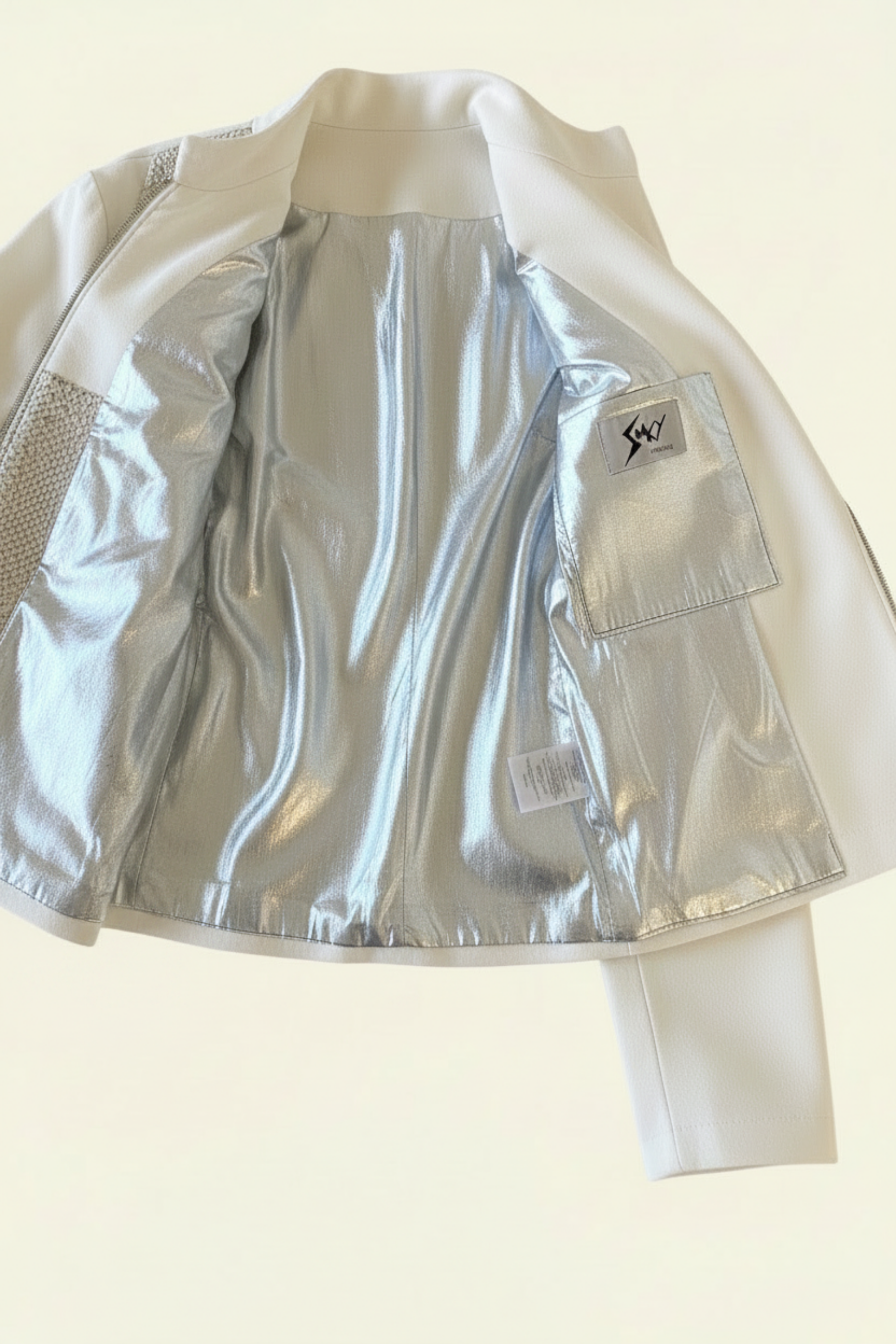 Stacy Stewart Smith Men's White Python & Denim Bellhop Jacket floating flat front view open silver lining with antique white wall backdrop.
