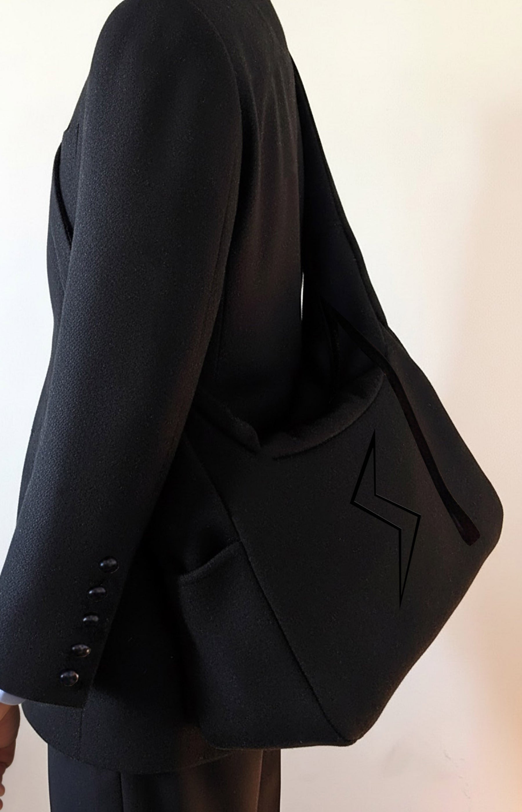Stacy  Stewart Smith Men's Black Harris Tweed® Messenger bag on Mannequin 6'3" against white background.