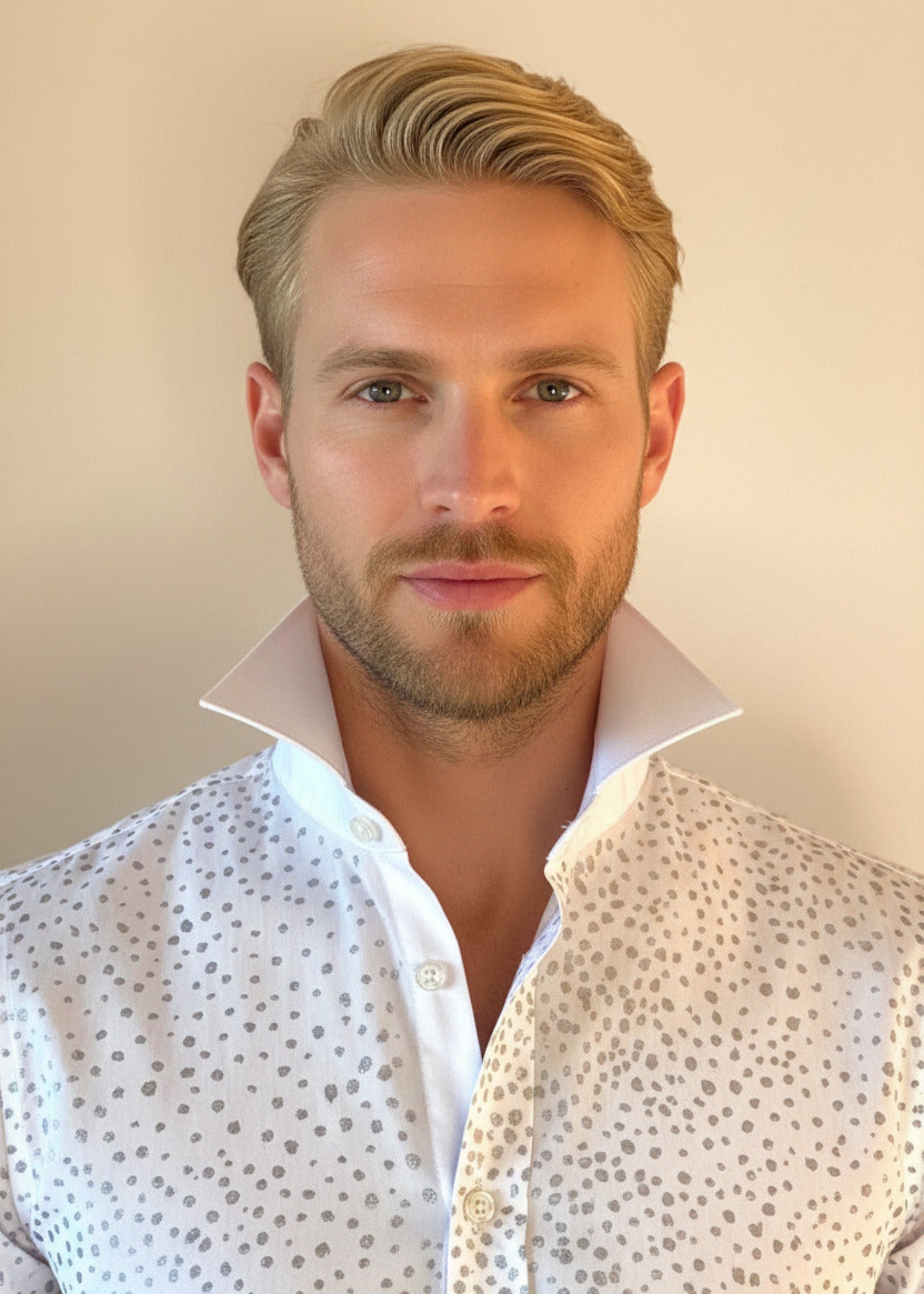 HOW TO TIE A CRAVAT: STEP 1 Atelier Quarterly presents Stacy Stewart Smith's Hand-Painted Cotton Percale Shirt on a male mannequin front view with collar up against an ivory backdrop.
