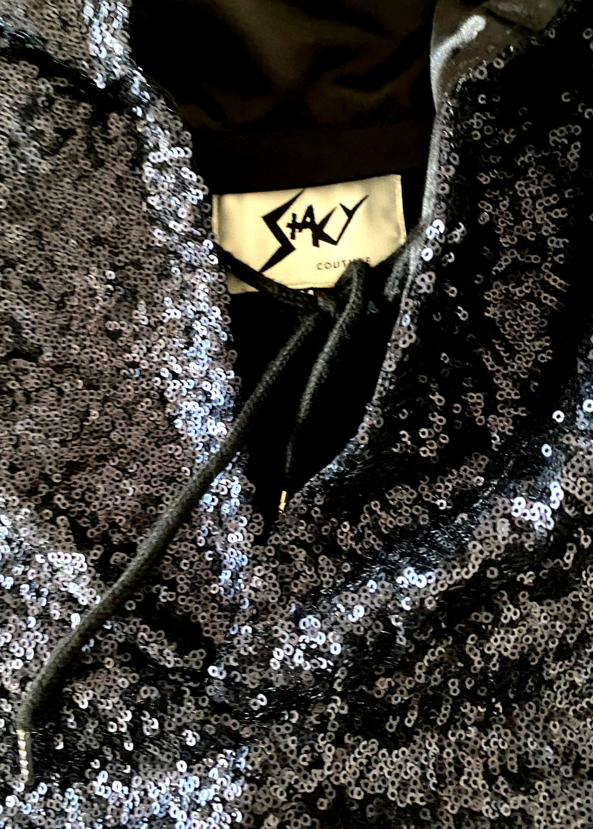 Stacy Stewart Smith Men’s Sequin and Hand-Printed Pixels Knight-Shirt on hanger zoomed neckline view showing brand label.