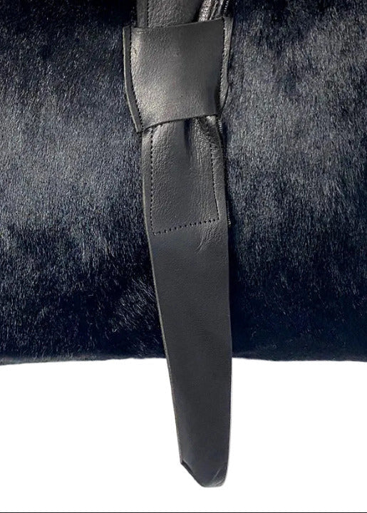 Stacy Stewart Smith Hair-On Calf Powder Satchel Bag front zoomed view of closure on gray background. 