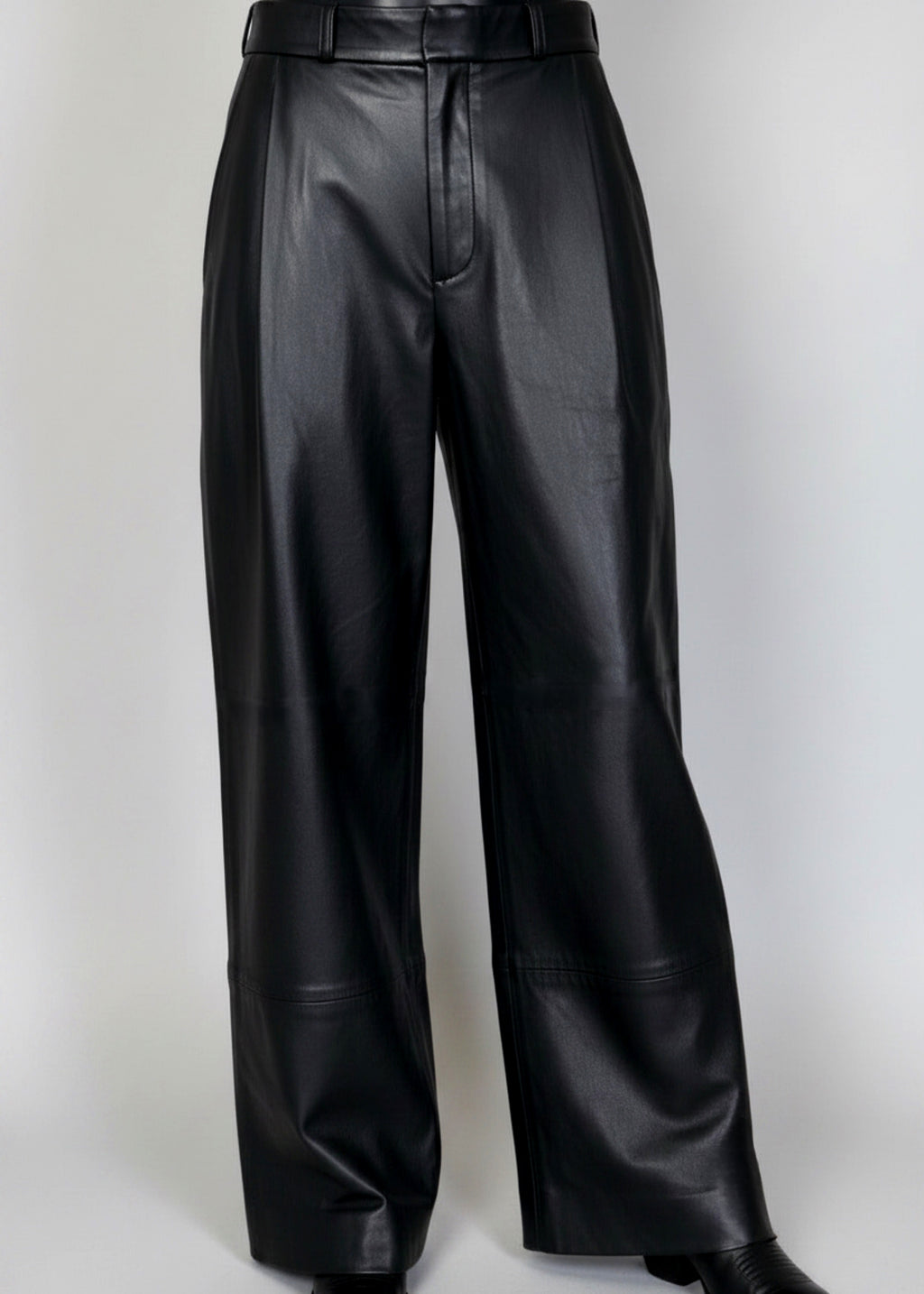 Stacy Stewart Smith Men's Onyx Leather Pleated Windsor Pants on mannequin 6'3" 3/4 full frontal view in black cowboy boots with gray backdrop 