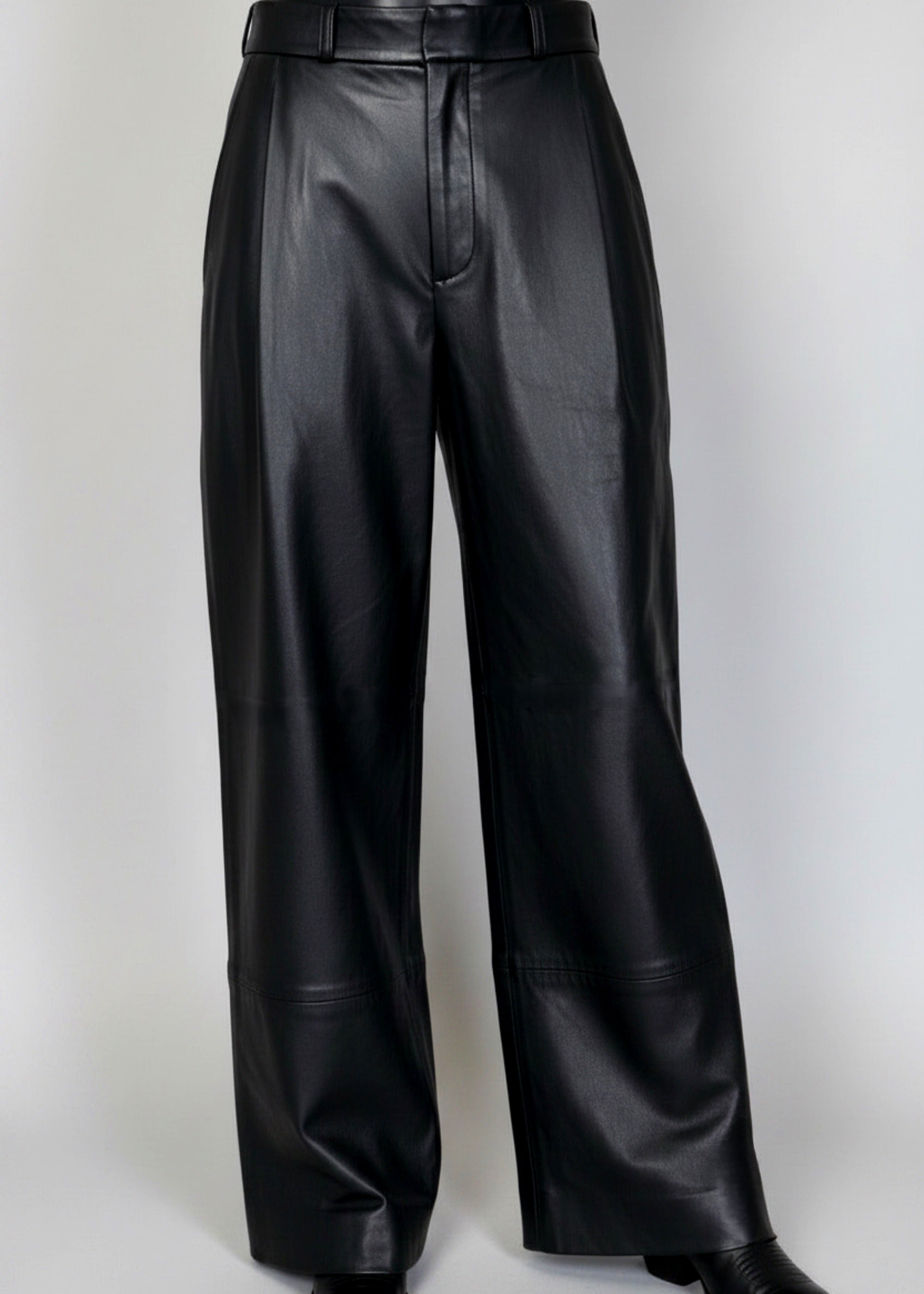 Stacy Stewart Smith Men's Onyx Leather Pleated Windsor Pants on mannequin 6'3" 3/4 full frontal view in black cowboy boots with gray backdrop 