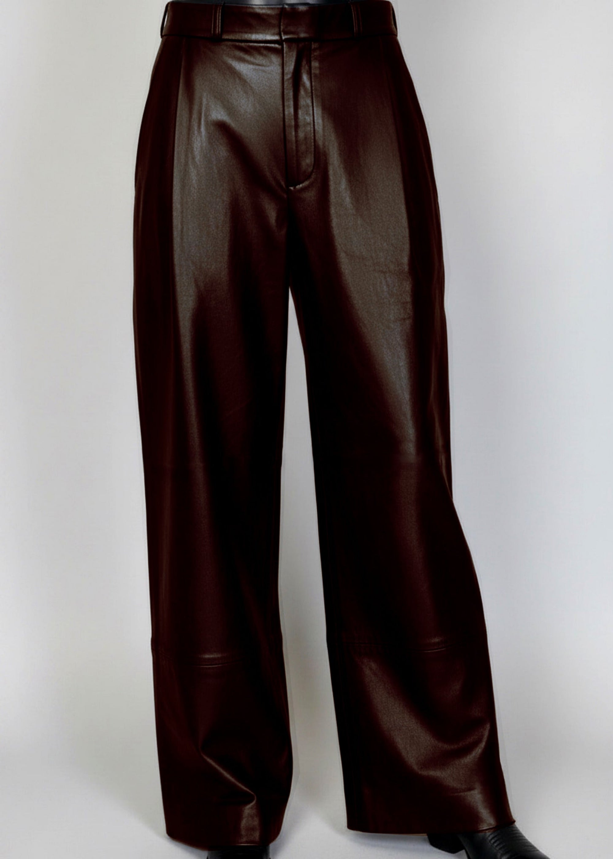 Stacy Stewart Smith Men's Espresso Leather Pleated Windsor Pants on mannequin 6'3" 3/4 full frontal view in black cowboy boots with gray backdrop 