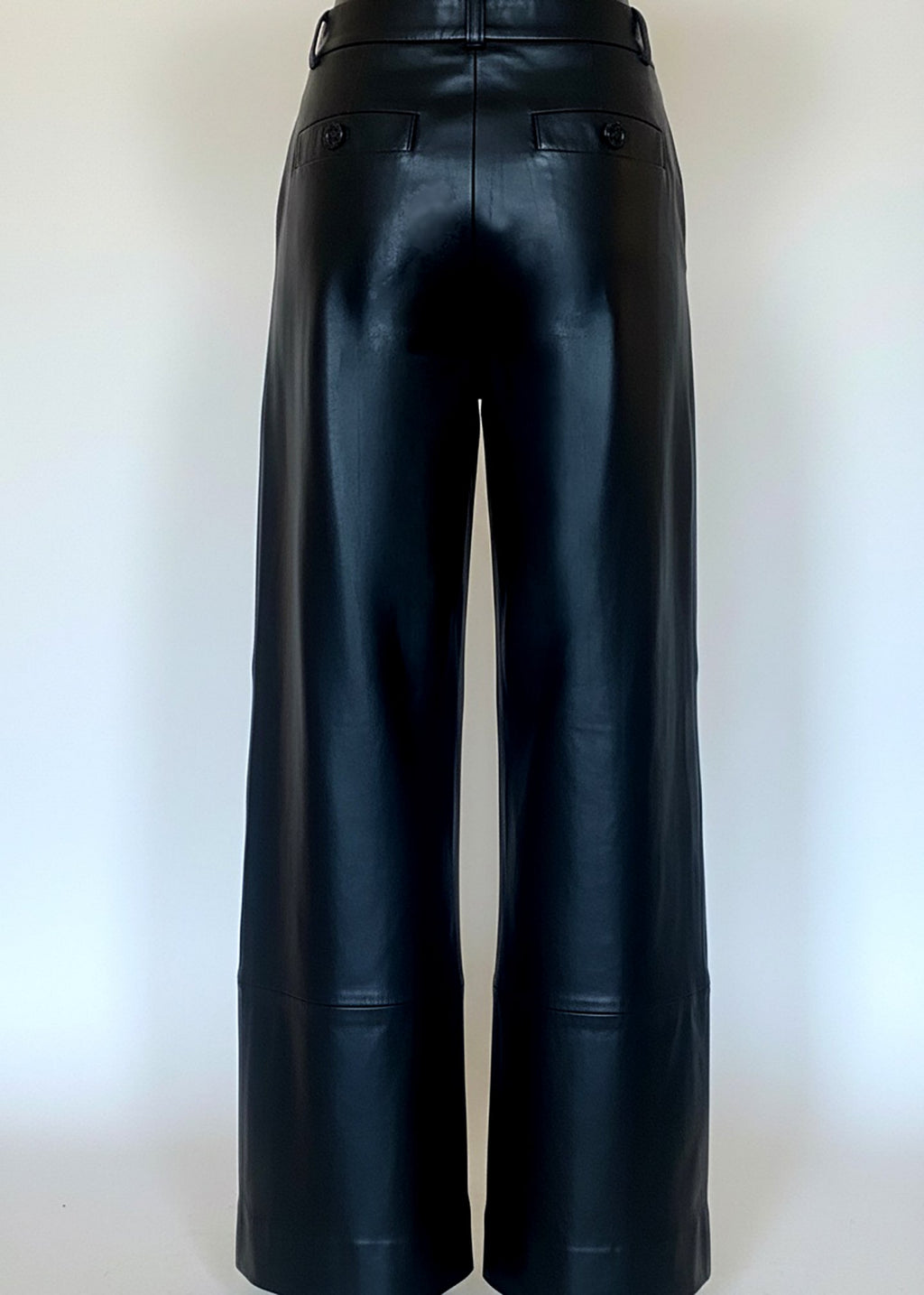 Stacy Stewart Smith Men's Onyx Leather Pleated Windsor Pants on mannequin 6'3" back view with gray backdrop.