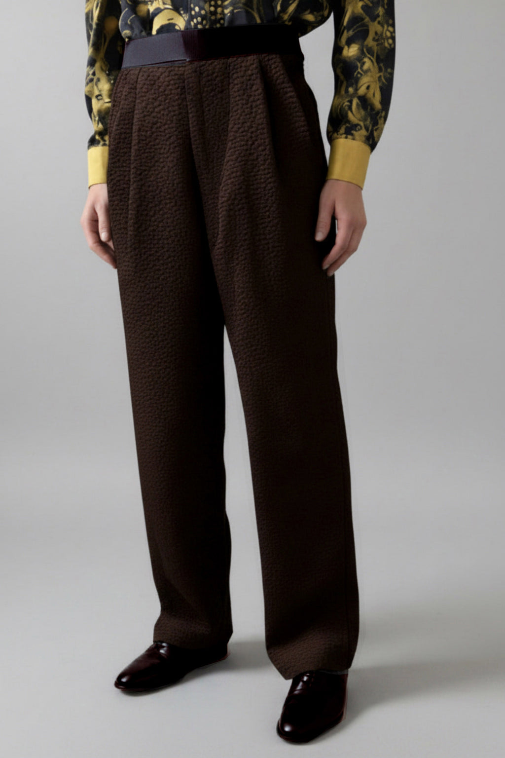 Stacy Stewart Smith Men's Espresso Faux Persian lamb pleated Windsor pants, shown on mannequin at 6'3