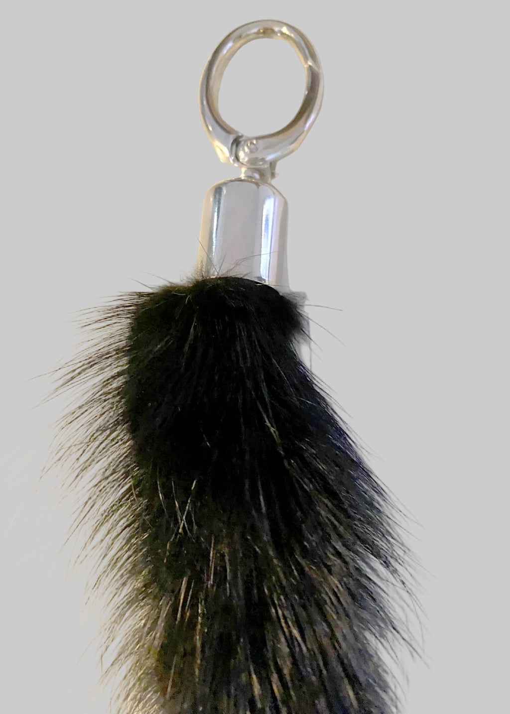 Stacy Stewart Smith Keychain with black mink fur tassel and silver ring on a light background
