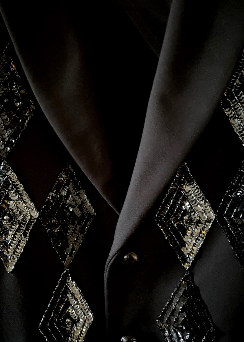 Stacy Stewart Smith Men's Black Knit, Sequin and Beaded Harlequin Blazer on a hanger zoomed front lapel view.