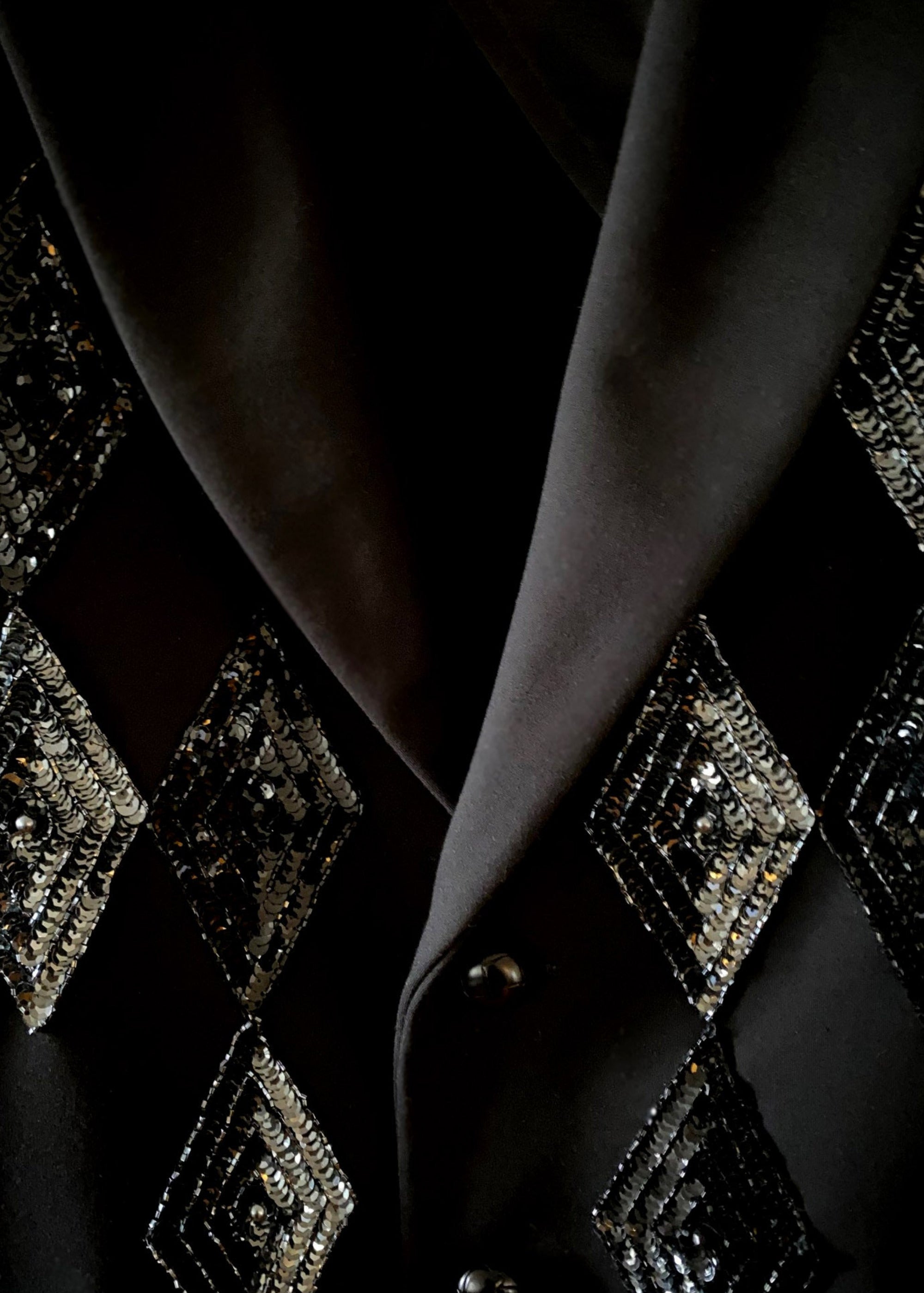 Stacy Stewart Smith Men's Black Knit, Sequin and Beaded Harlequin Blazer on a hanger zoomed front lapel view.