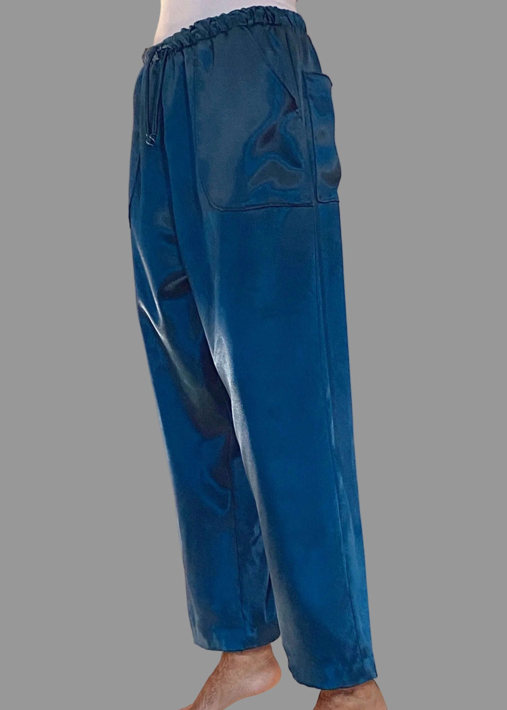 Stacy Stewart Smith Men's Blue Lagoon Satin Jiu-jitsu Pants on a mannequin 6'3" 3/4 view. 