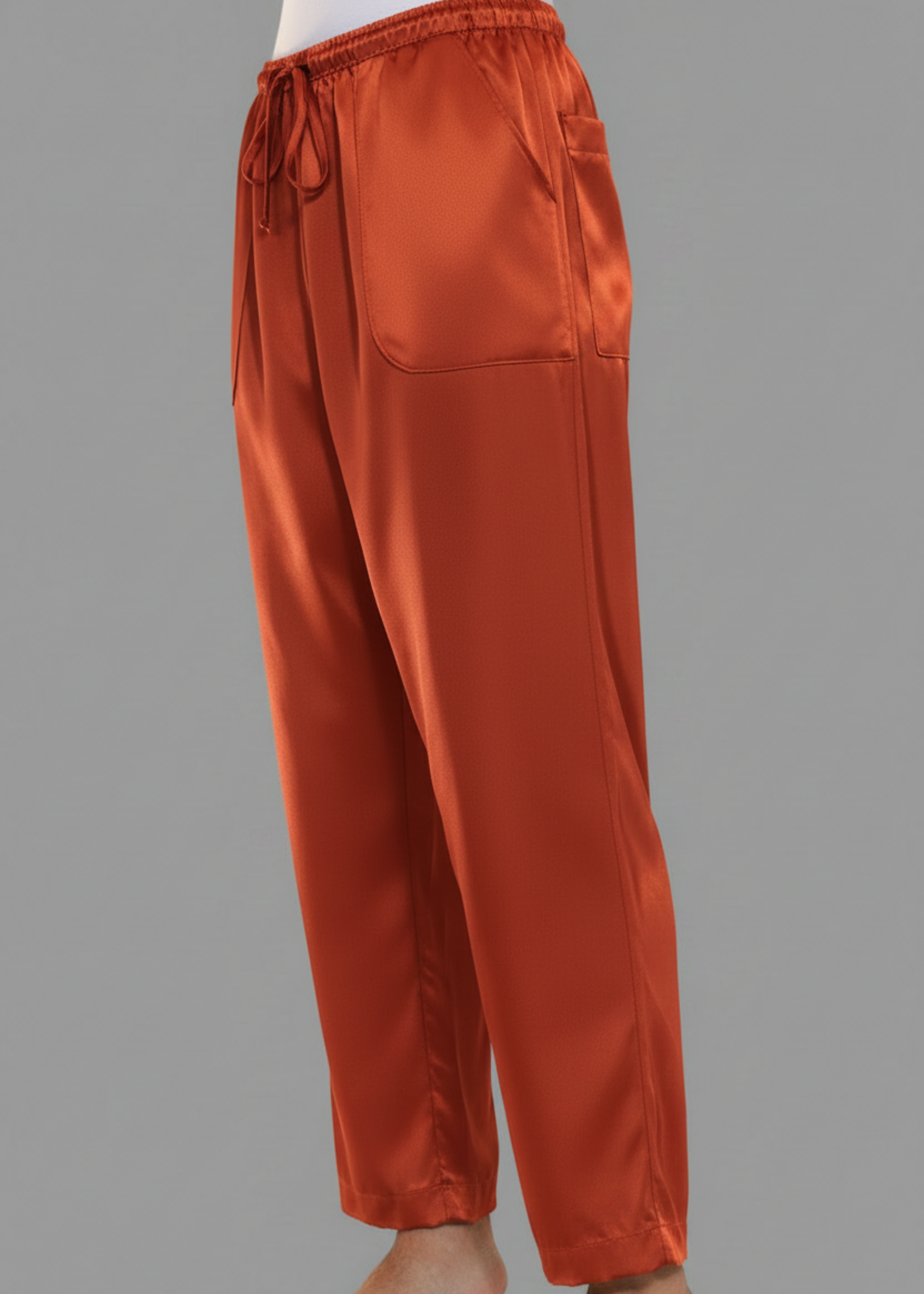 Stacy Stewart Smith Men's Persimmon Satin Jiu-jitsu Pants on a mannequin 6'3" 3/4 view. 