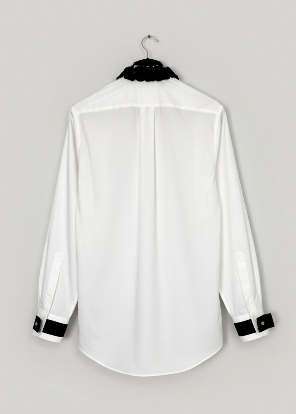 Stacy Stewart Smith Men's Leviathan Scales Western Tuxedo Shirt on a hanger  back view.