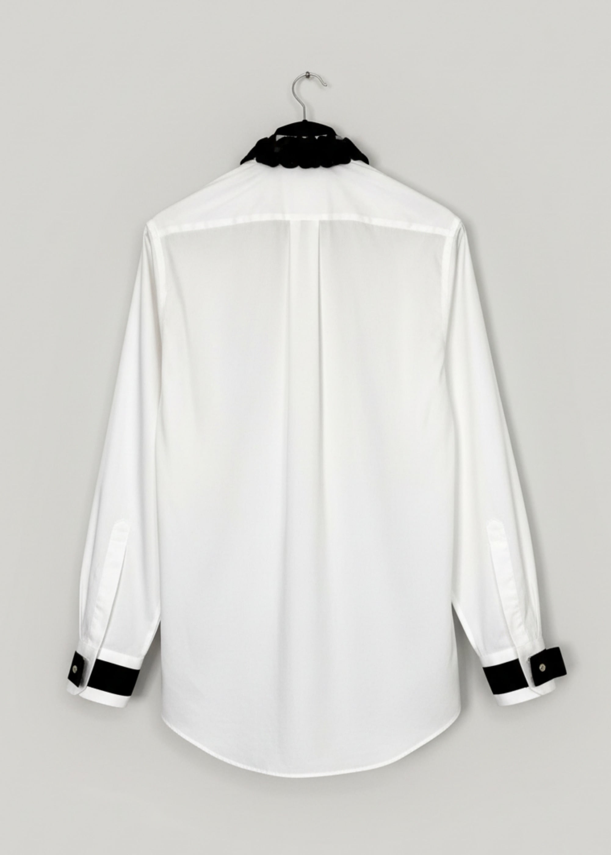 Stacy Stewart Smith Men's Leviathan Scales Western Tuxedo Shirt on a hanger  back view.