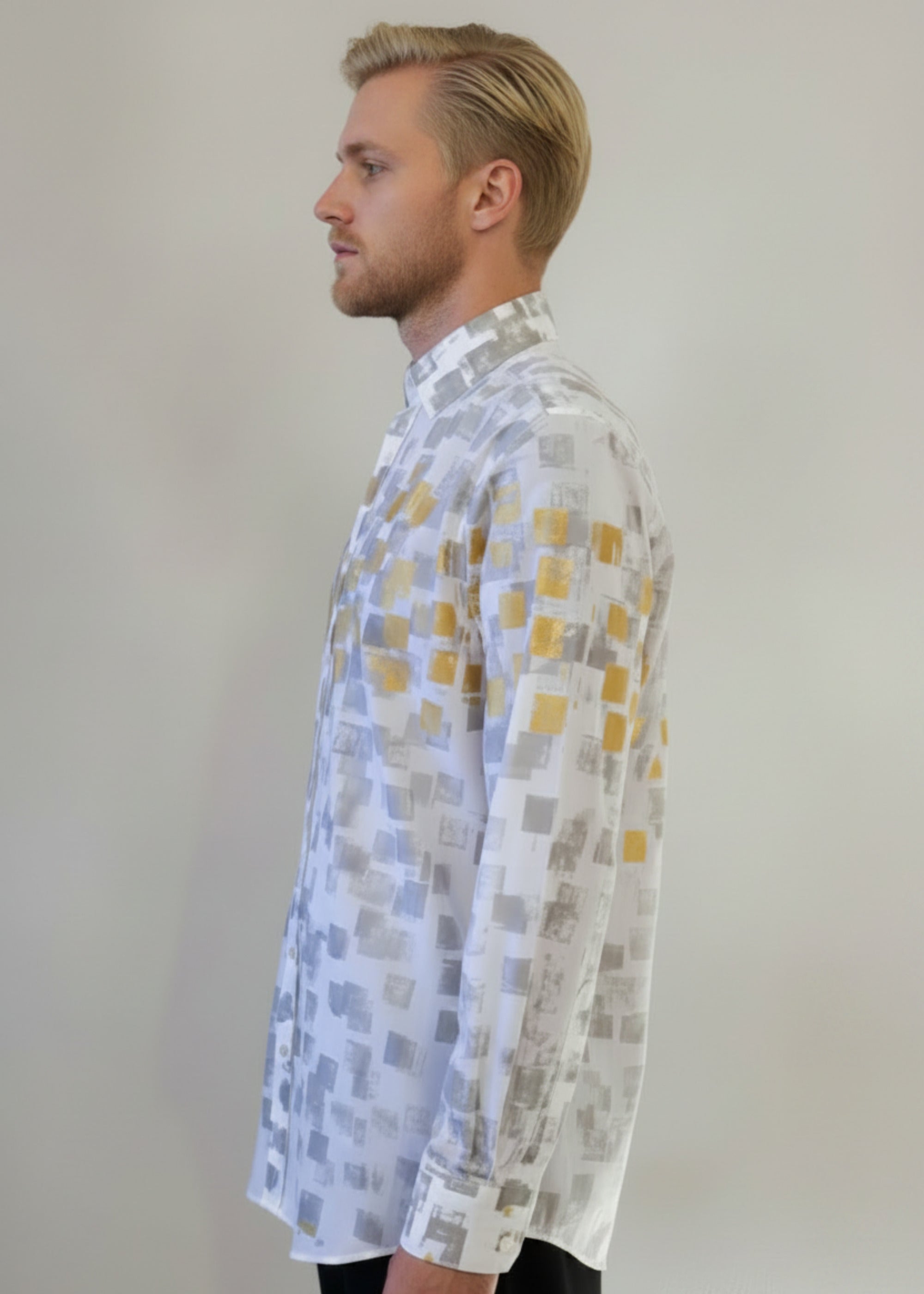 Stacy Stewart Smith Men's White Premium Cotton Percale Hand-Painted Gold & Silver Pixels Shirt on a glass mannequin 6'3" left side view with gray background. 