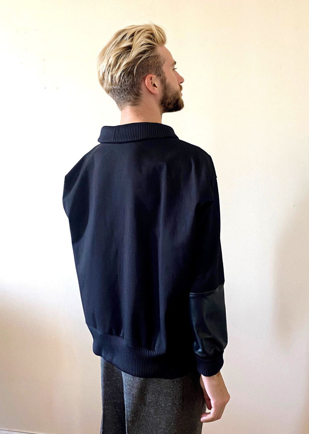 Stacy Stewart Smith Men's Black Harlequin Patch Sweatshirt on mannequin 6'3" frontal view mock neck down back view against antique white wall. 