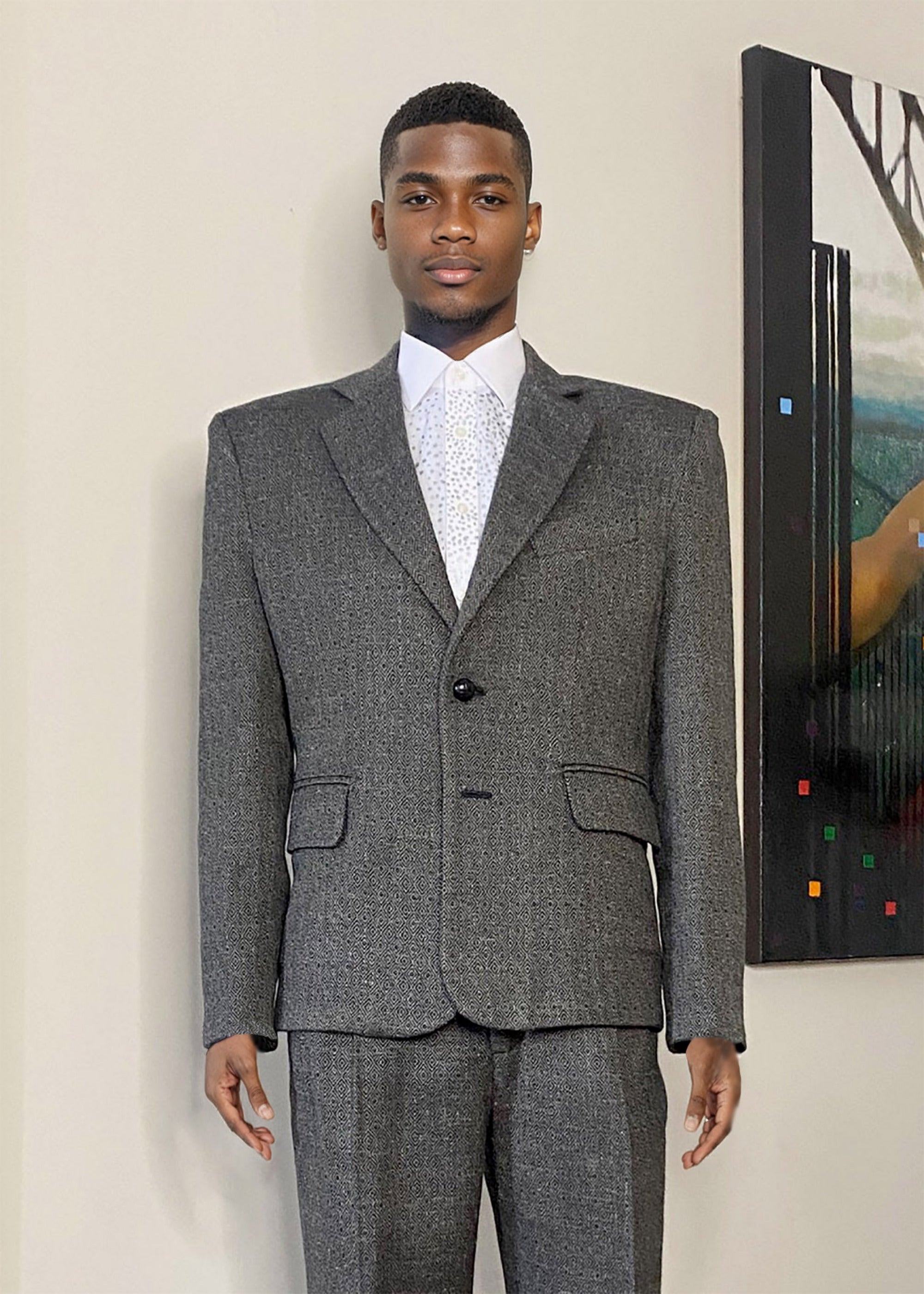 Stacy Stewart Smith Men's Diamond Dodger Tweed Notched Lapel Blazer on a mannequin 6'3" (front view) against an Antique White wall with a Stacy Stewart Smith oil painting hanging.