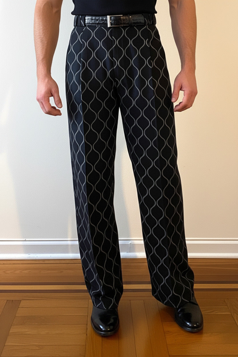 Stacy Stewart Smith Men's Ogee Embroidered Raw Silk Pleated Windsor Pants on a mannequin 6'3" front view pants in a room with a wooden floor and antique white wall.