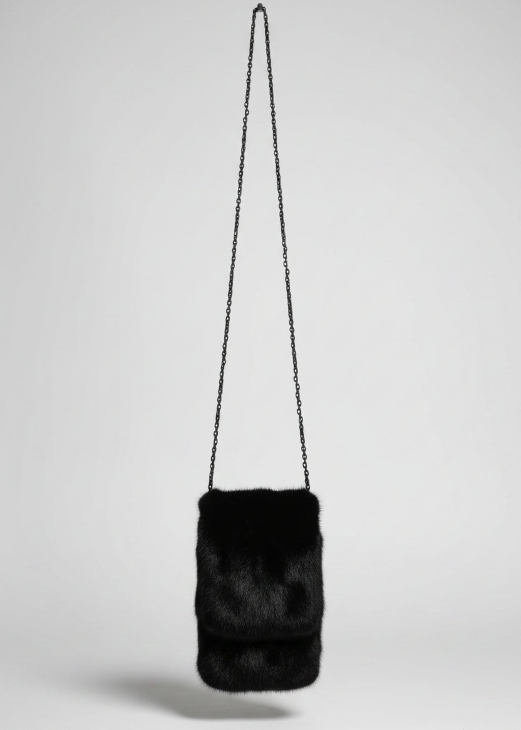 Stacy Stewart Smith Men's Black Gamma mink Sporran Pocket Bag front view hanging with gray backdrop.