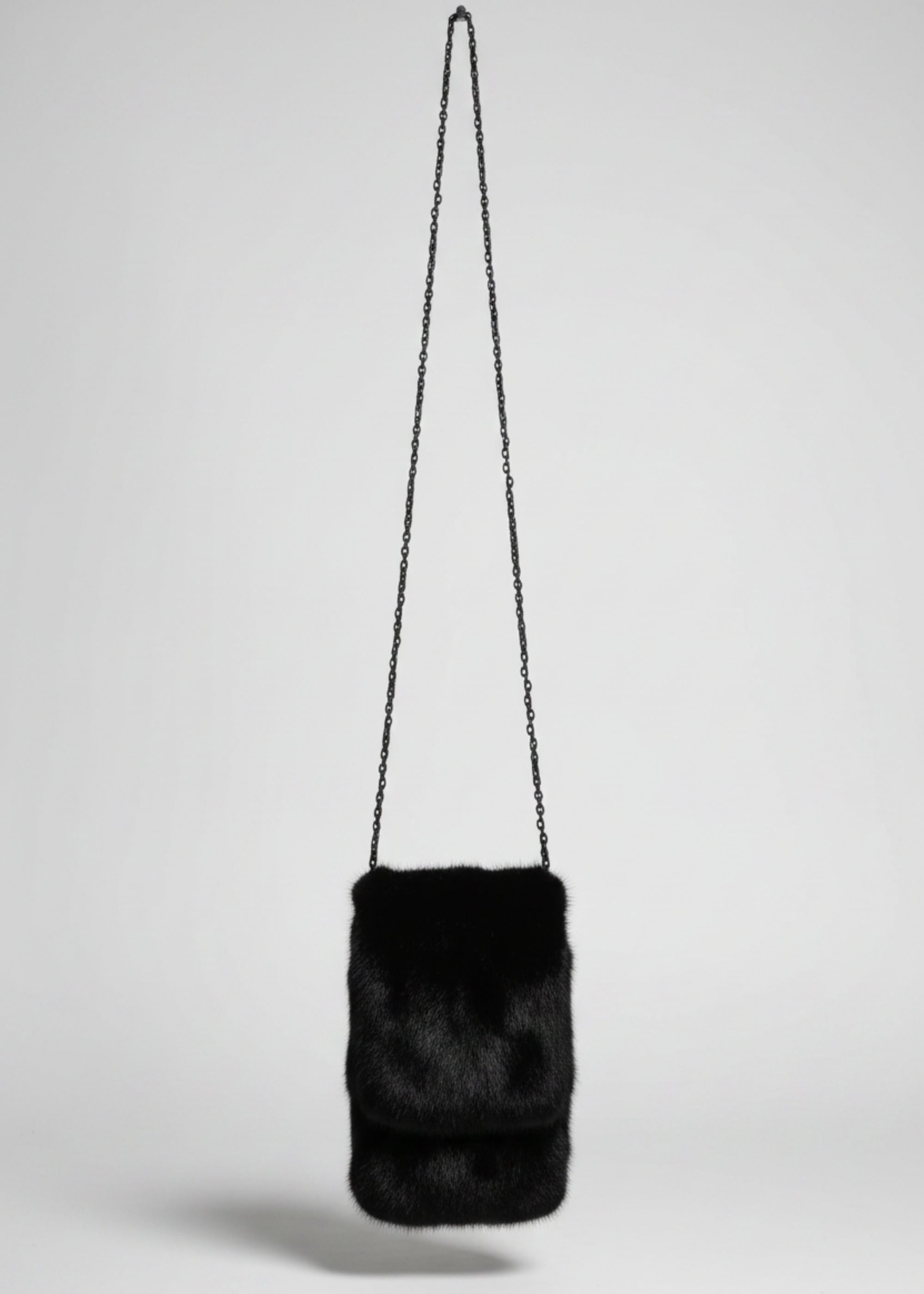 Stacy Stewart Smith Men's Black Gamma mink Sporran Pocket Bag front view hanging with gray backdrop.