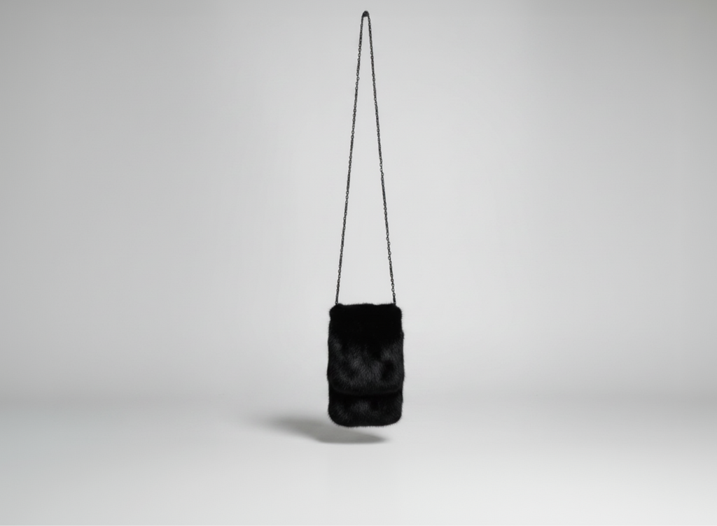 Stacy Stewart Smith Men's Black Gamma mink Sporran Pocket Bag landscape front view hanging with gray backdrop.