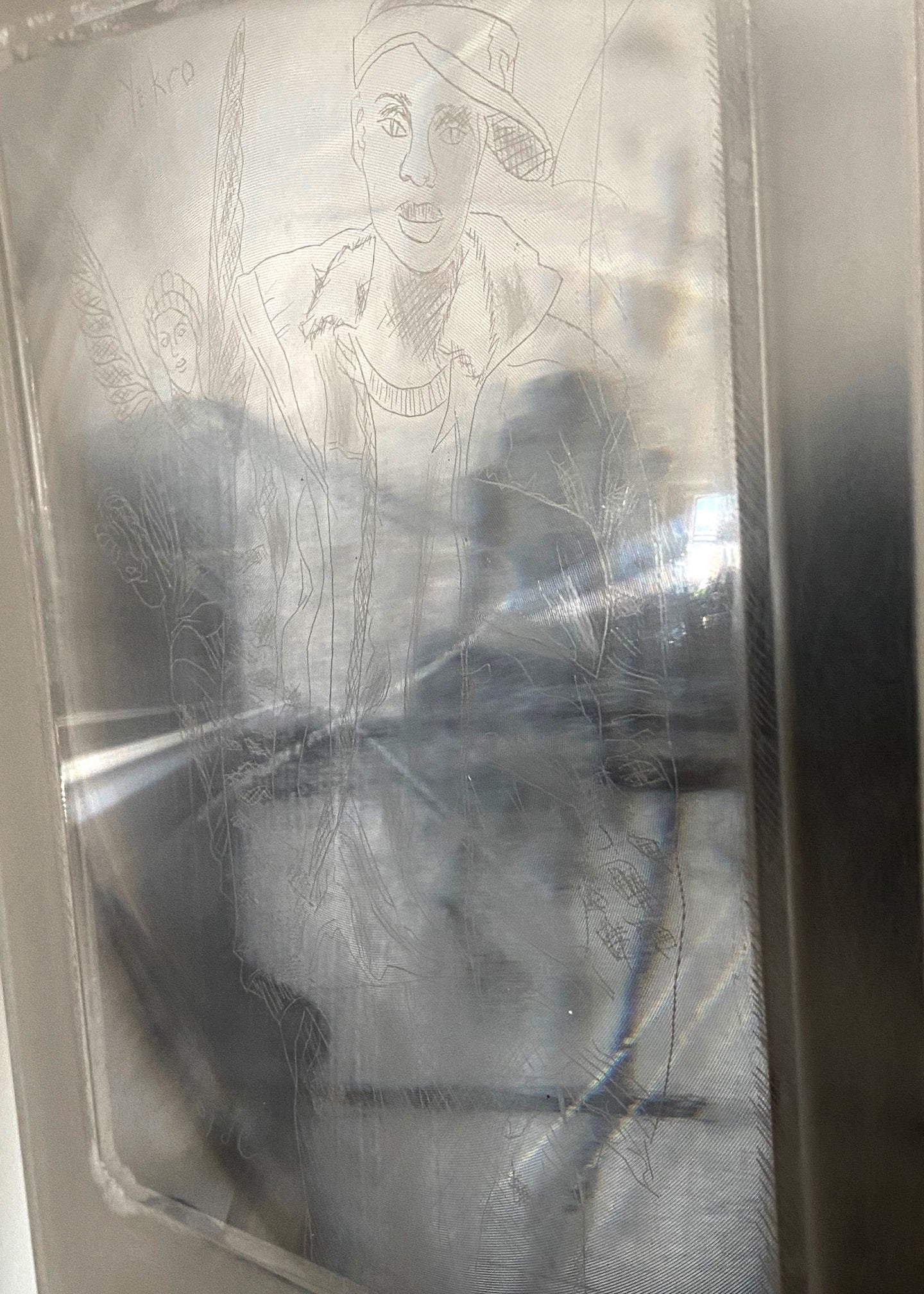 Sanctuary of Dreams: Week Three Painting shadow box by Stacy Stewart Smith three-quarters view showing shadows cast into the plexiglass from male figure as part of scrachiti etchings and words in unknown language.