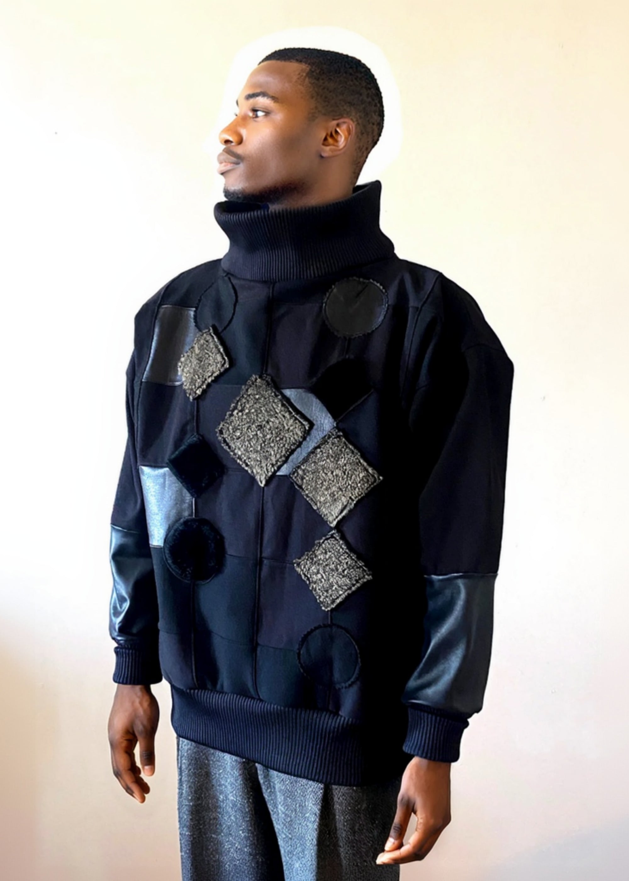 Stacy Stewart Smith Men's Black Harlequin Patch Sweatshirt on mannequin 6'3" frontal view mock neck up.
