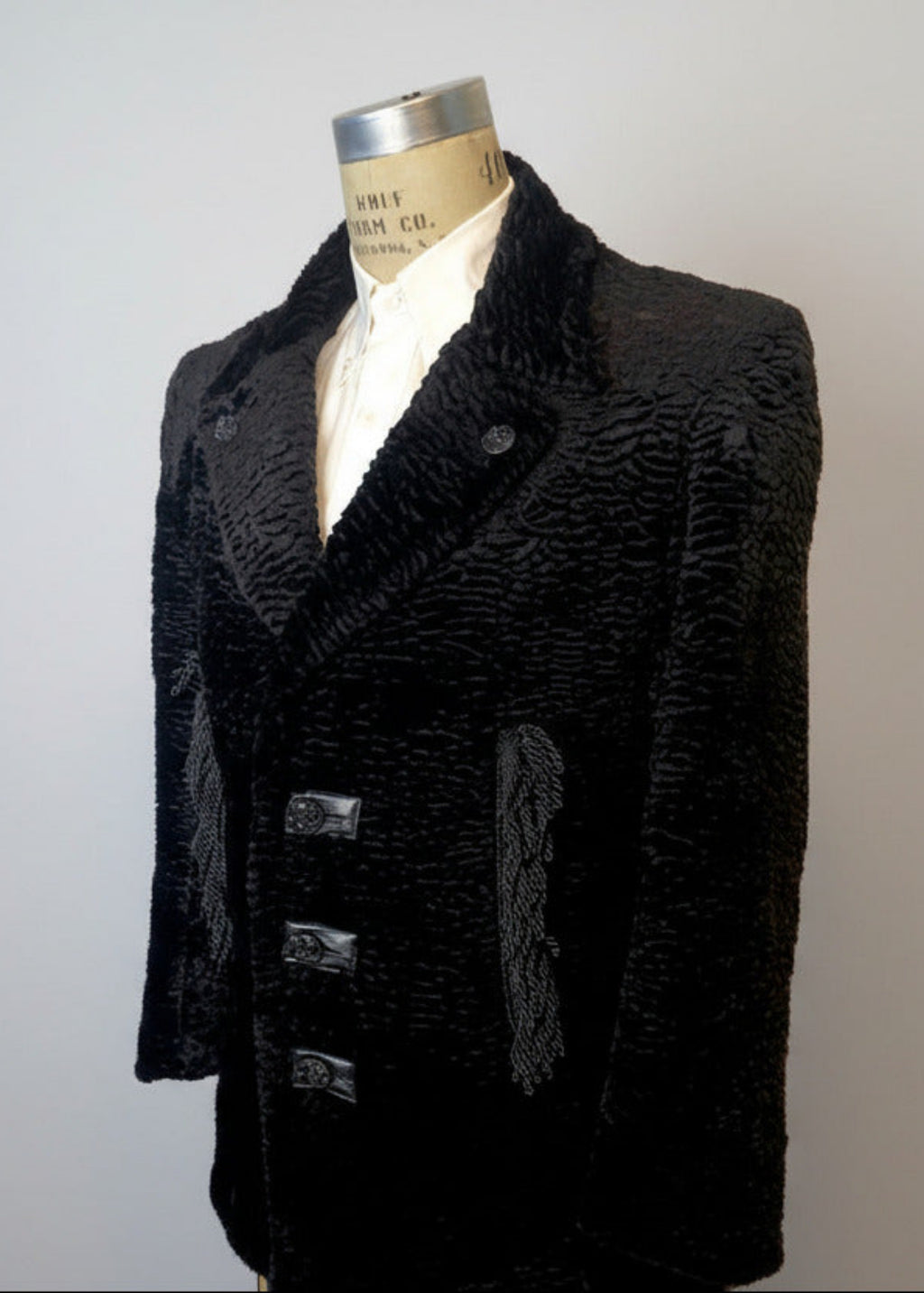 Stacy Stewart Smith Men's Black Knight Faux Persian Lamb Coat in Coal Black, three-quarter view shown on 40R Wolf form