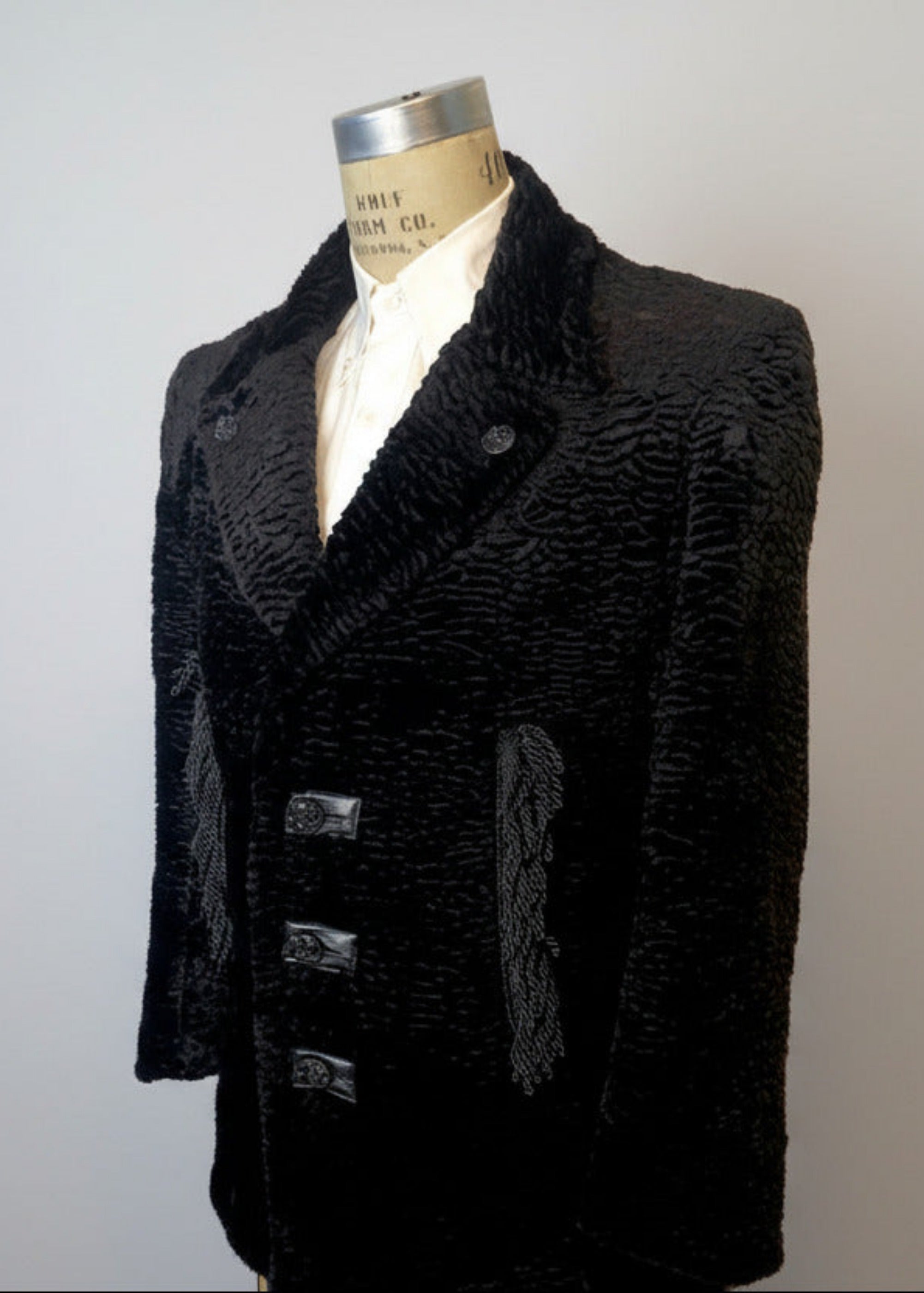 Stacy Stewart Smith Men's Black Knight Faux Persian Lamb Coat in Coal Black, three-quarter view shown on 40R Wolf form