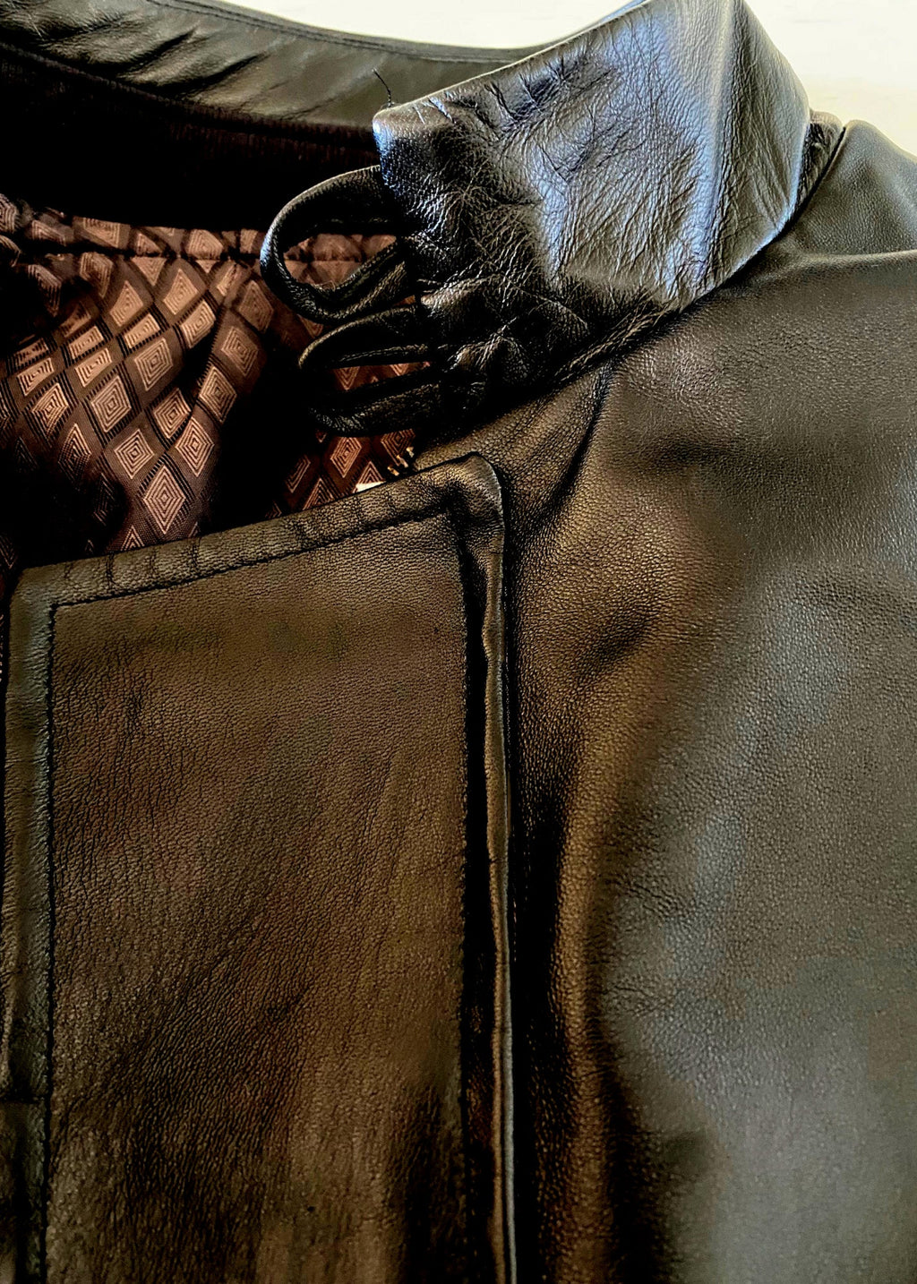 Stacy Stewart Smith Men's Flange-Back Leather Moto Jacket flat zoomed front  neck view open against an antique white background.