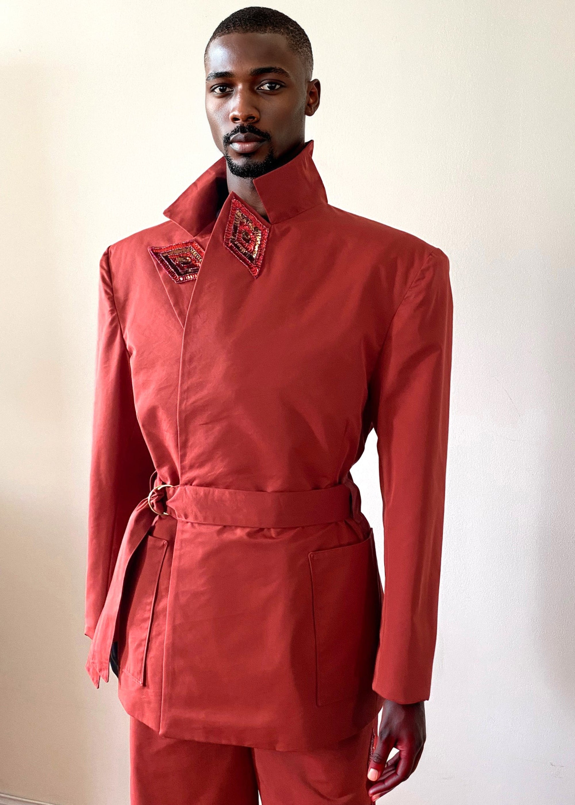 Sky & Ruby Trench-Jack persimmon front view collar up on a mannequin 6'3" in front of an antique white wall.