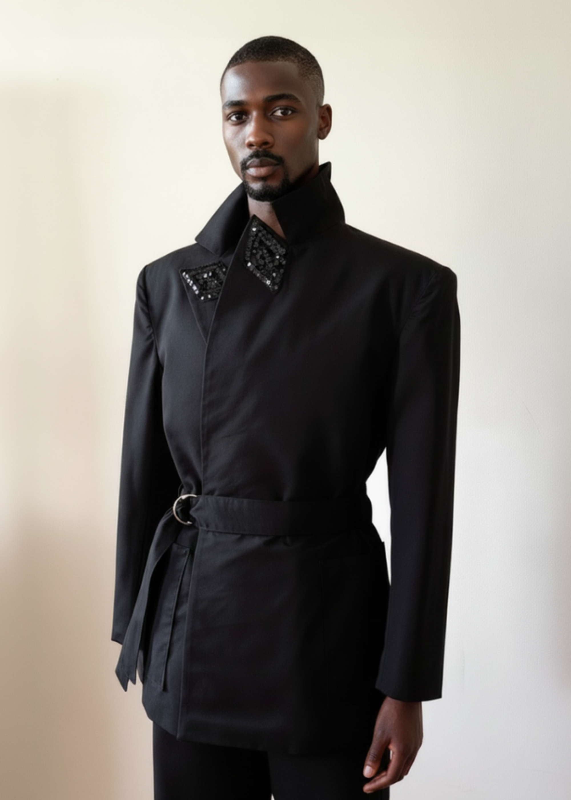 Sky & Ruby Trench-Jack in black front view collar up on a mannequin 6'3" in front of an antique white wall.