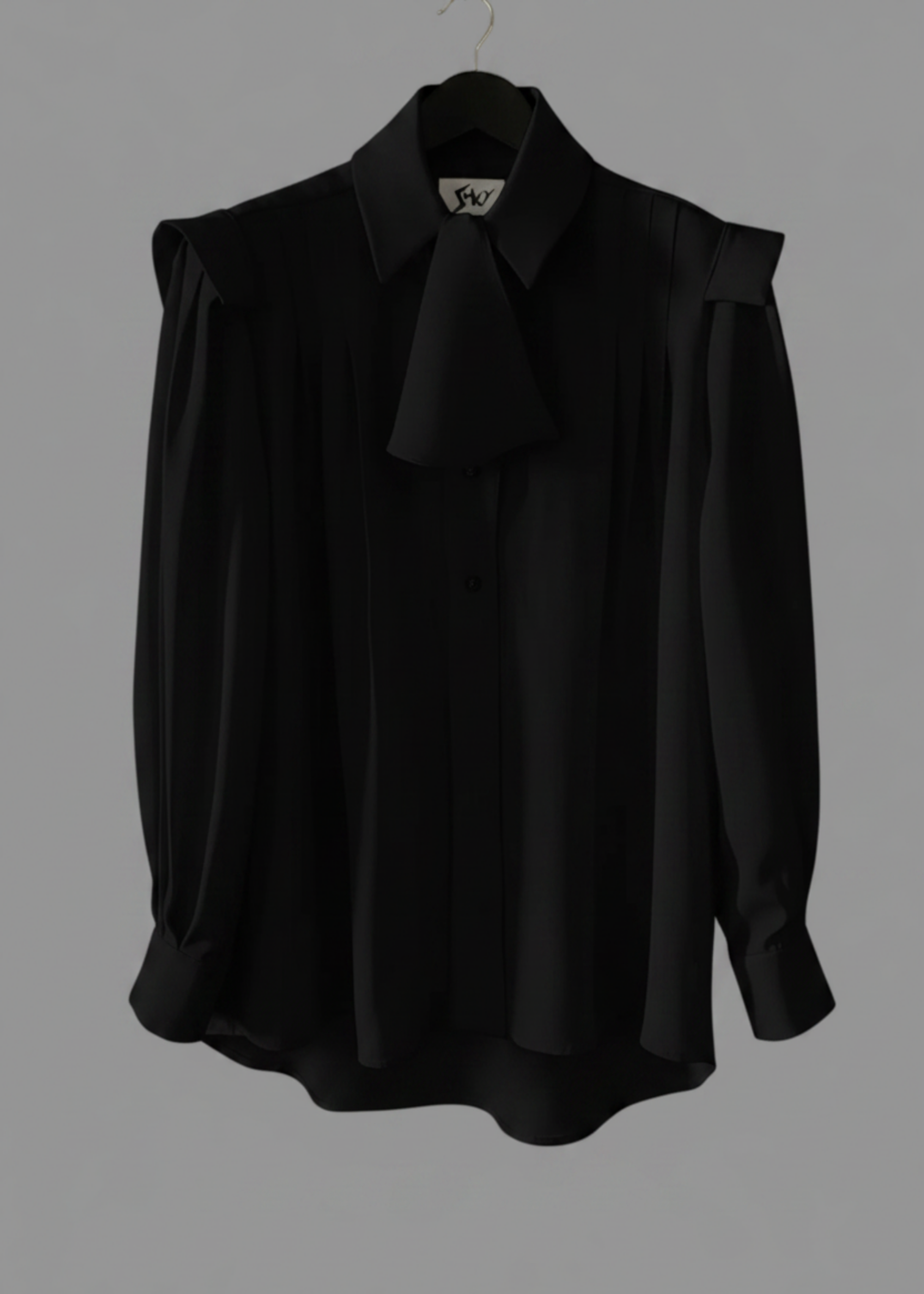 Stacy Stewart Smith Men's Poet Laureate Black Silk Crepe Shirt on a hanger front flat view with jabot against gray backdrop.