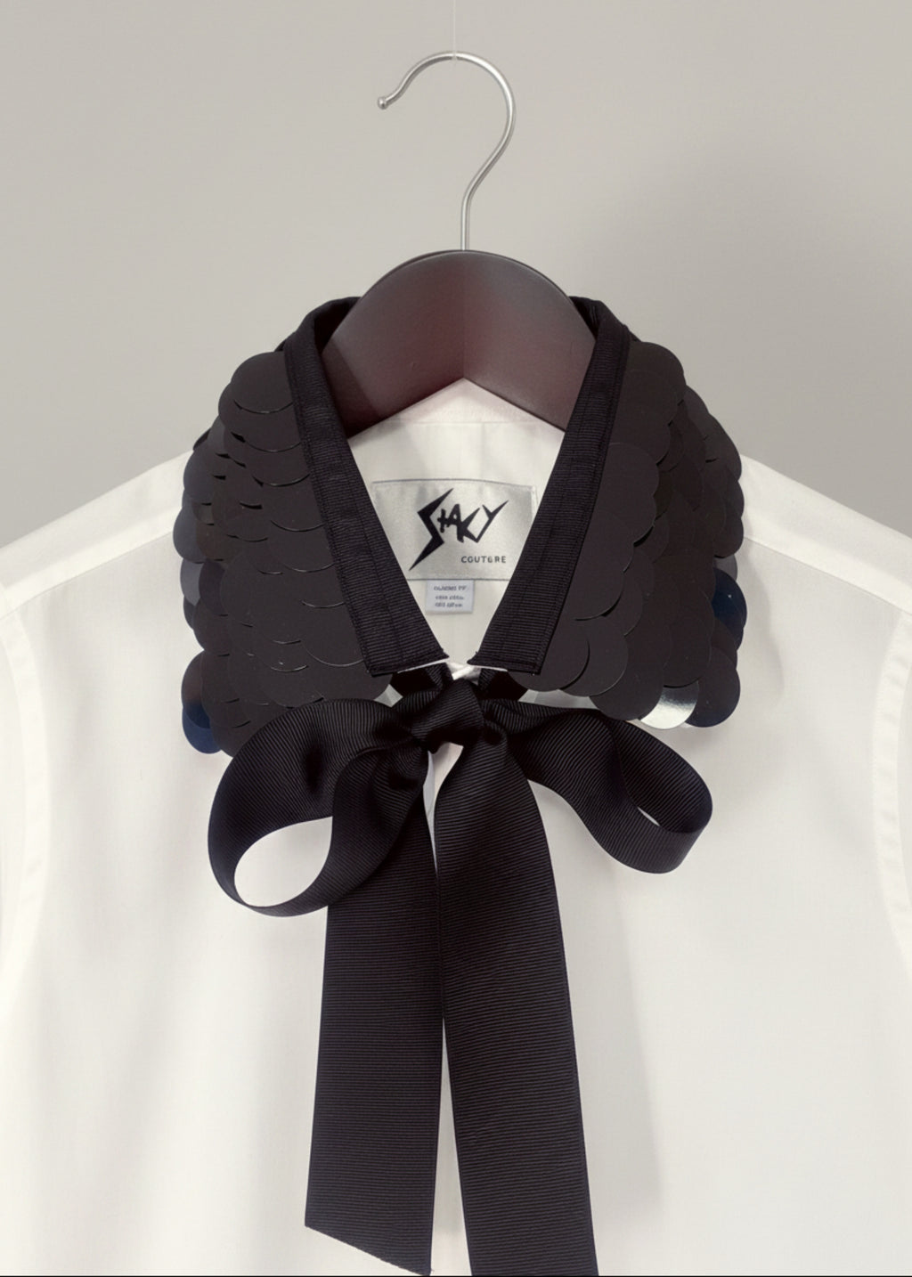Stacy Stewart Smith Men's White Leviathan Scales Western Tuxedo Shirt on hanger zoomed front collar view.