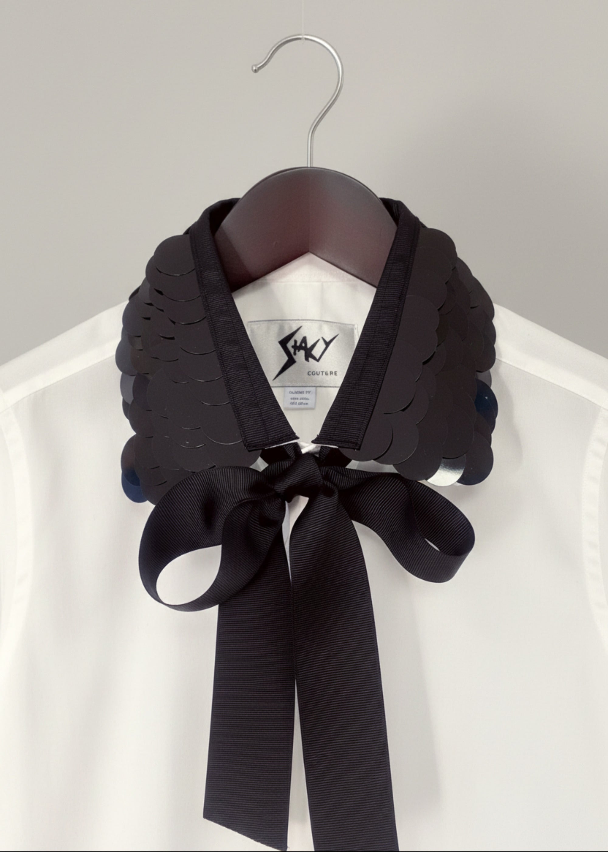 Stacy Stewart Smith Men's White Leviathan Scales Western Tuxedo Shirt on hanger zoomed front collar view.