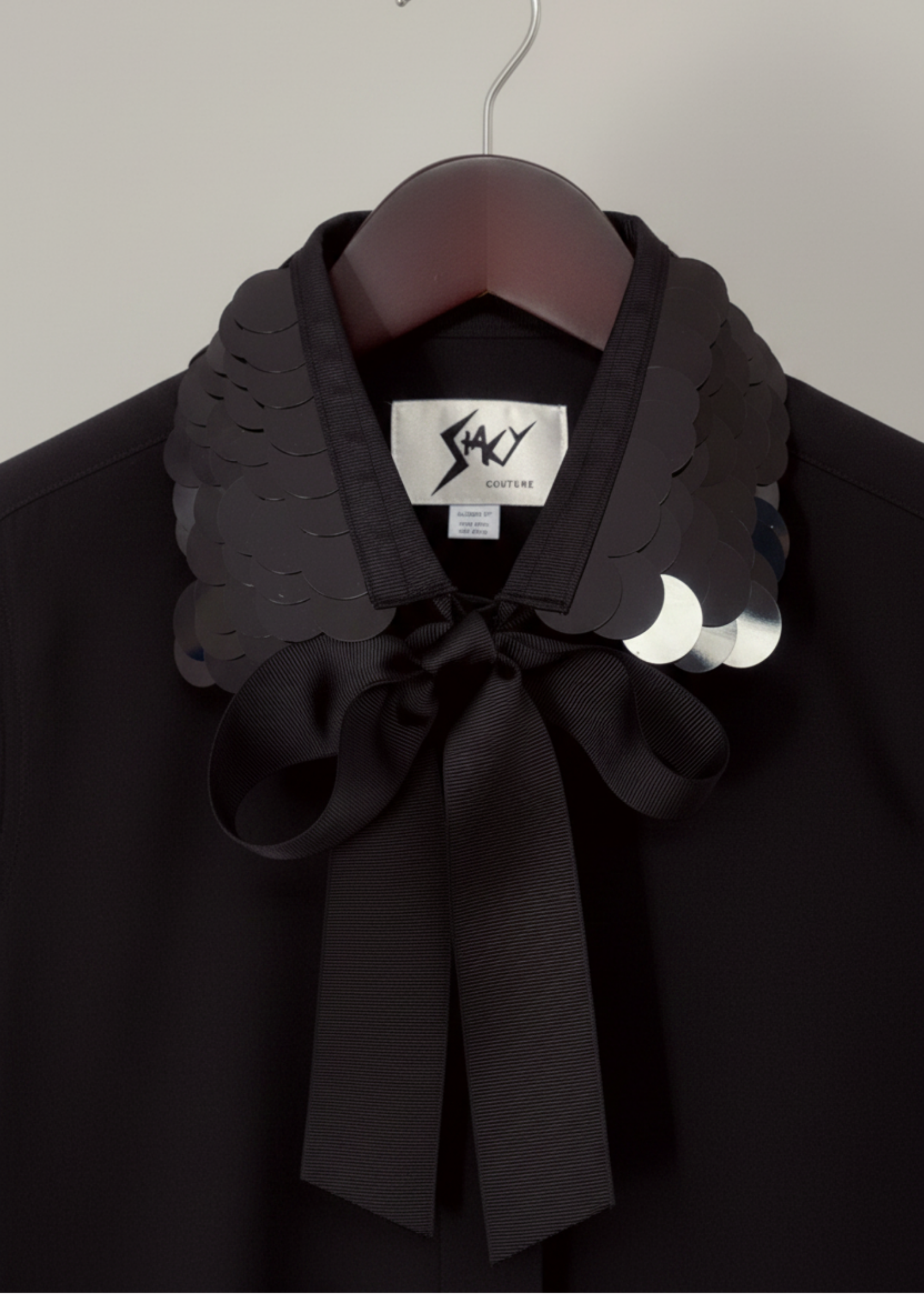 Stacy Stewart Smith Men's Black Leviathan Scales Western Tuxedo Shirt on hanger zoomed front collar view.
