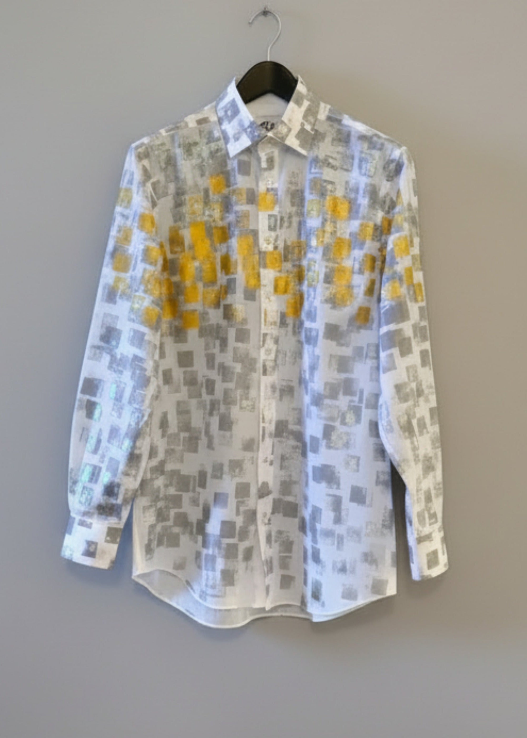 Stacy Stewart Smith Men's White Premium Cotton Percale Hand-Painted Gold & Silver Pixels Shirt front view on a hanger with gray background. 
