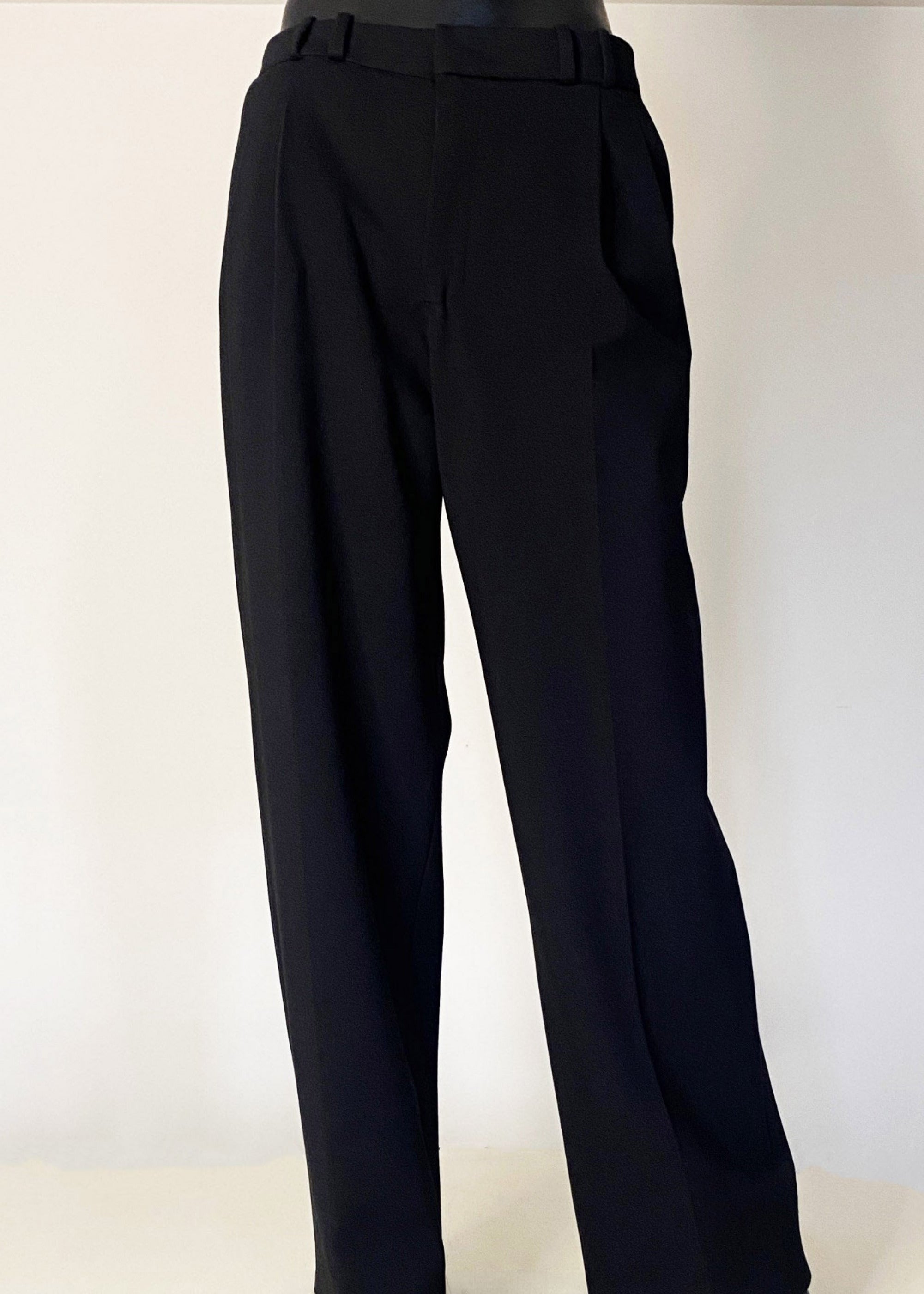 Stacy Stewart Smith Men's Black Knit Pleated Windsor Pants on mannequin 6'3" full front view with ivory backdrop. 