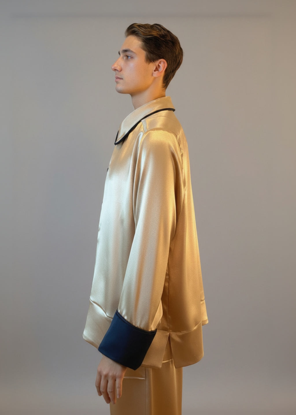 Stacy Stewart Smith Men's Golden Tang Satin Lounge Set on a mannequin 6'3" closed with the collar down side zoomed view.