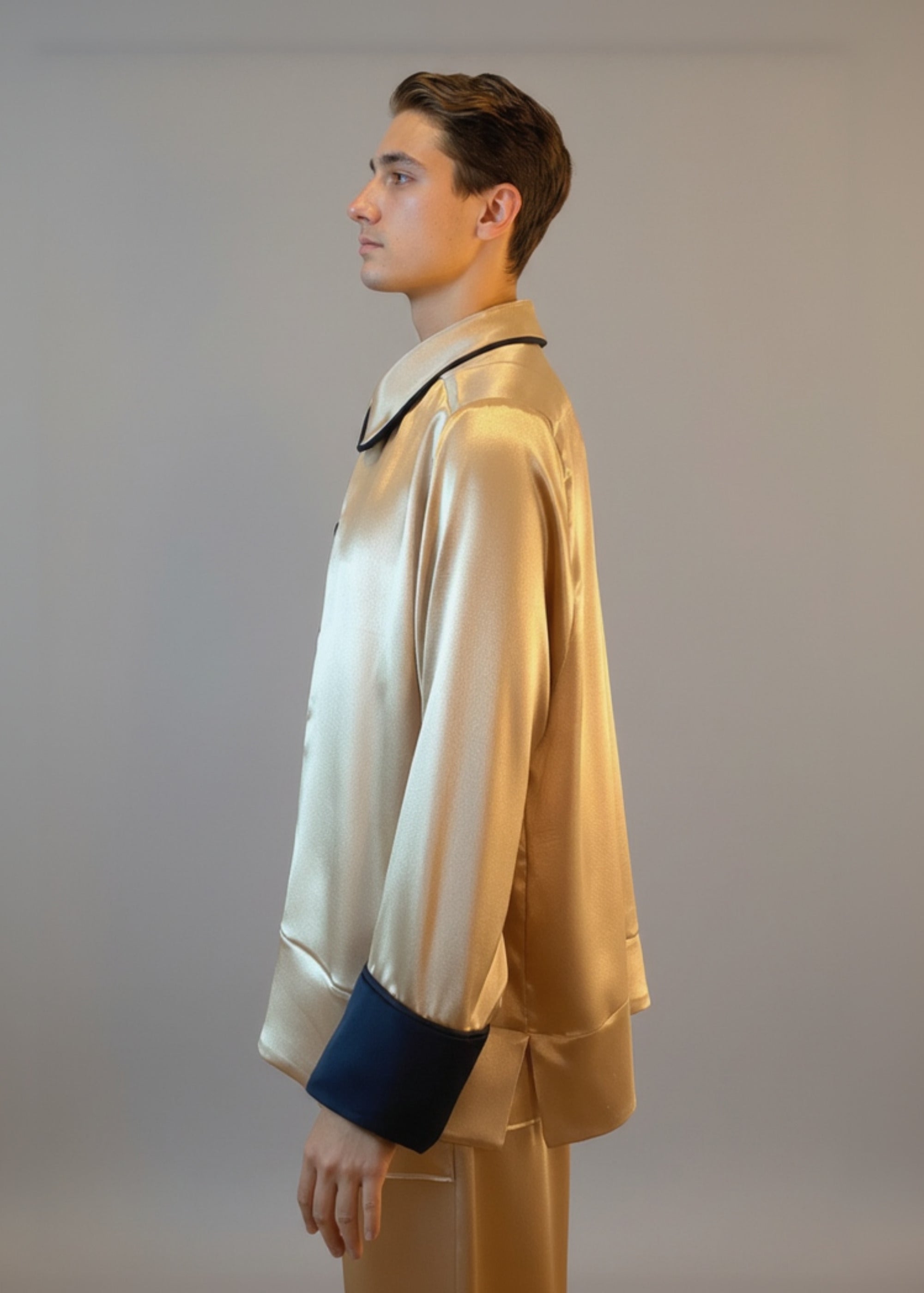 Stacy Stewart Smith Men's Golden Tang Satin Lounge Set on a mannequin 6'3" closed with the collar down side zoomed view.