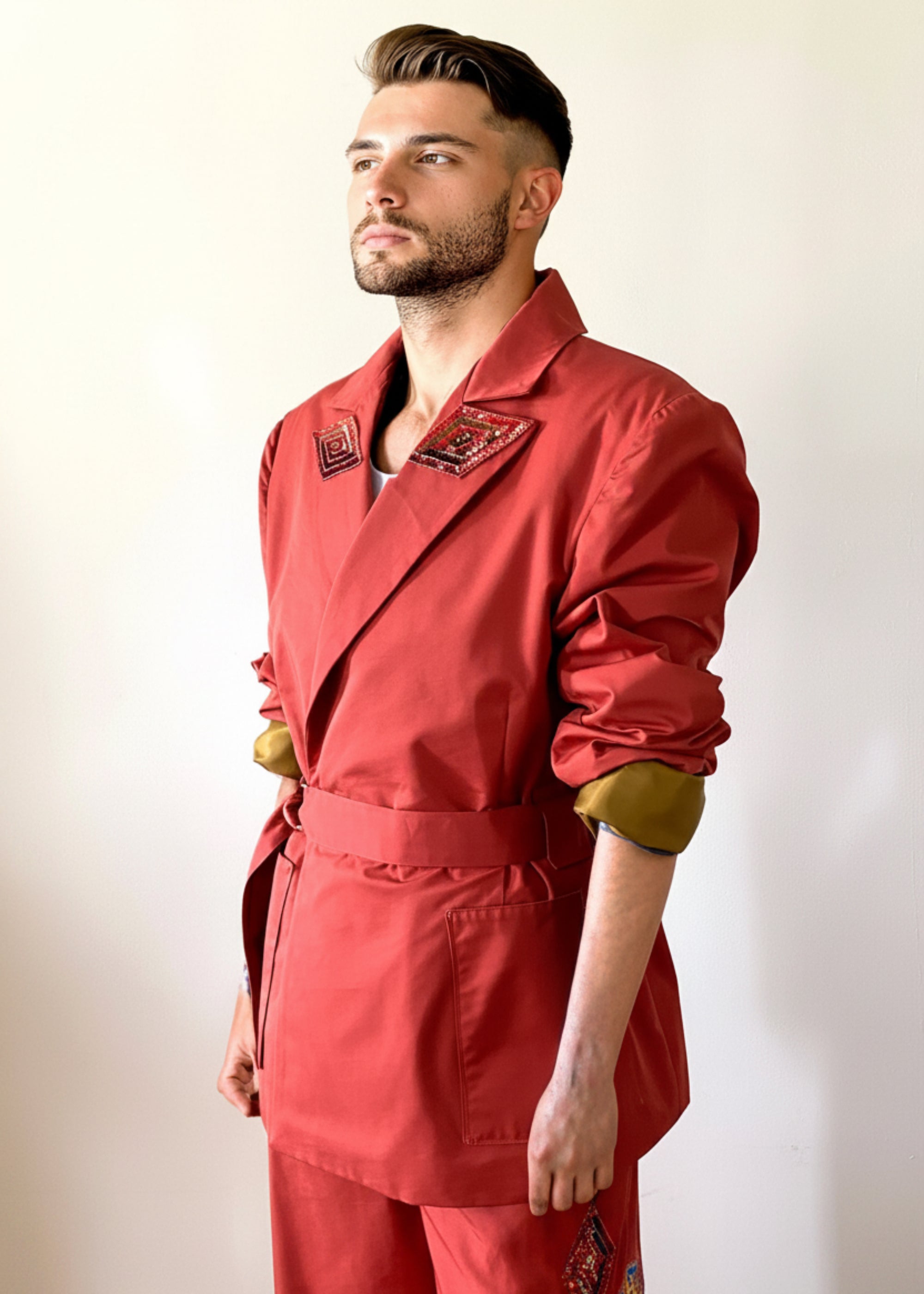 Sky & Ruby Trench-Jack front 3/4 view with sleeves rolled up on  mannequin 6'3" in front of an antique white wall.