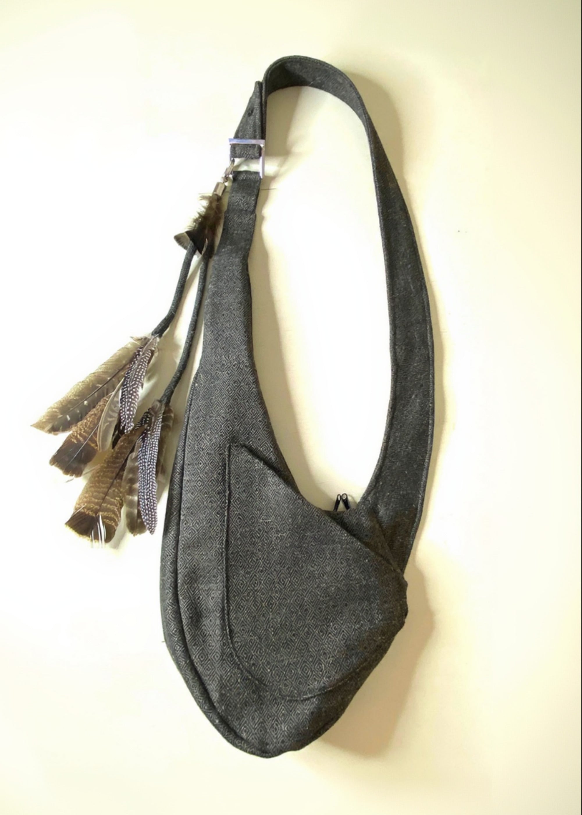 Stacy Stewart Smith Men's Diamond Dodger Tweed Newsie Sling Bag on an Ivory Surface front view.