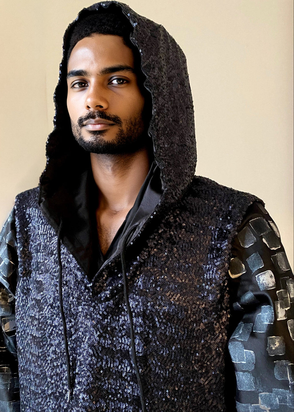 Stacy Stewart Smith Men’s Sequin and Hand-Printed Pixels Knight-Shirt on mannequin 6'3" front view zoomed  with hood on.