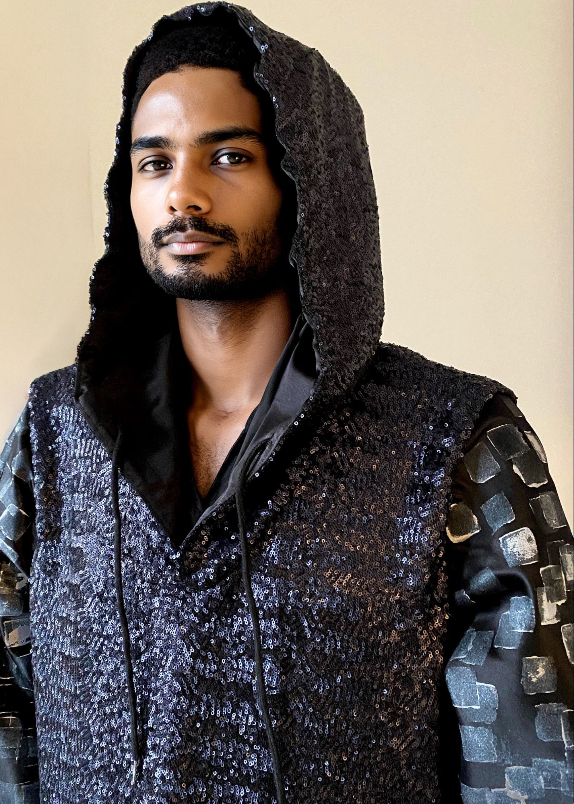 Stacy Stewart Smith Men’s Sequin and Hand-Printed Pixels Knight-Shirt on mannequin 6'3" front view zoomed  with hood on.