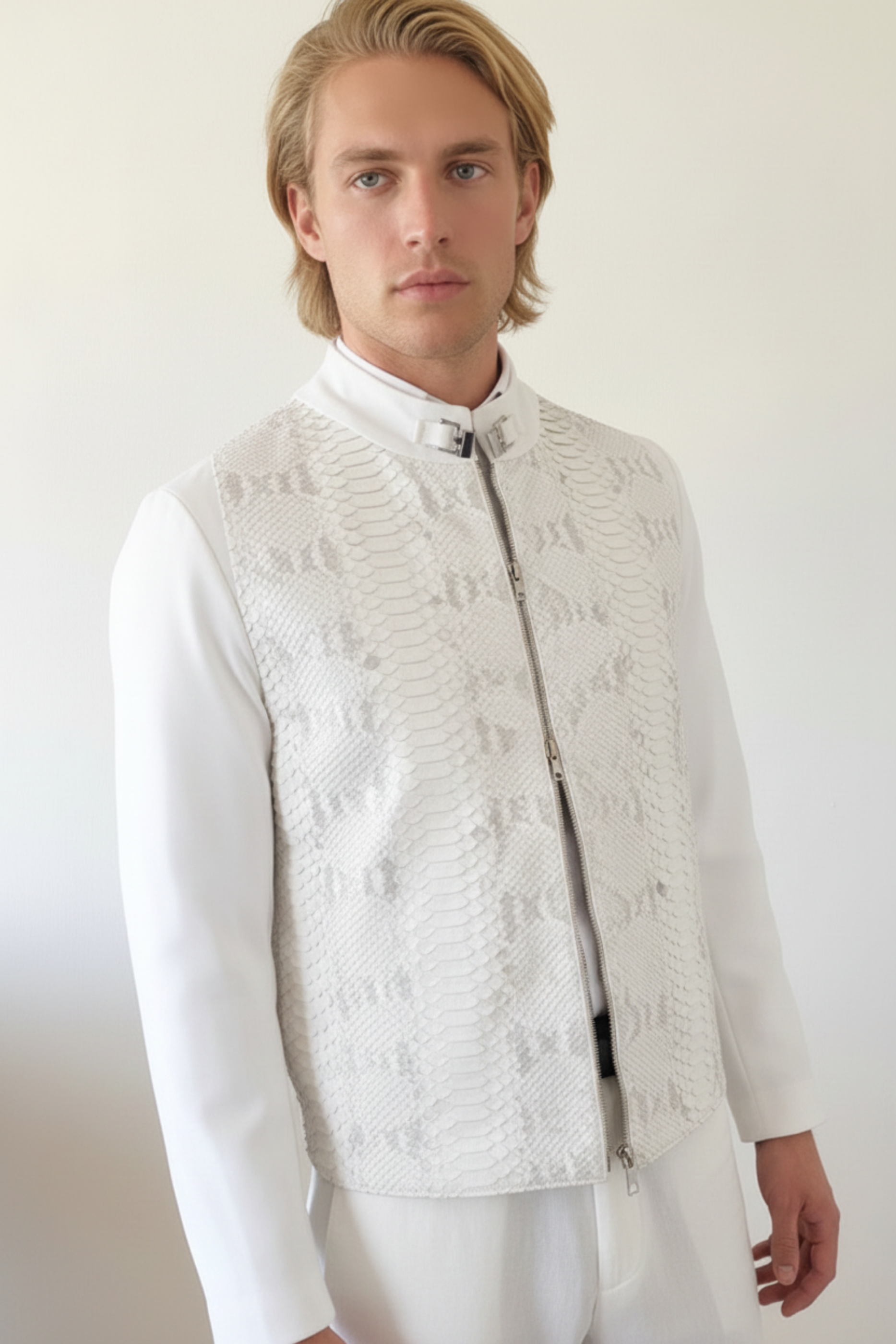 Stacy Stewart Smith Men's White Python & Denim Bellhop Jacket on mannequin 6'3" double-side zipper front view  with antique white wall backdrop.