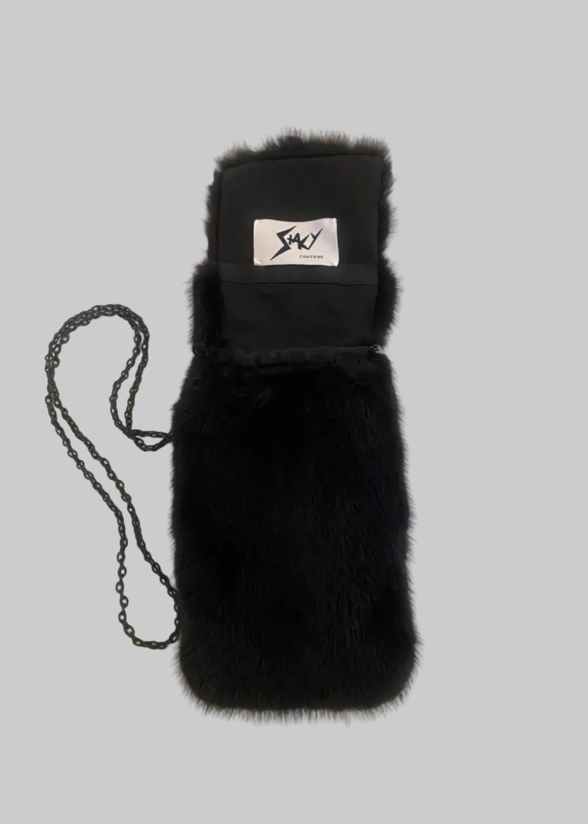 Stacy Stewart Smith Men's Black Gamma mink Sporran Pocket Bag flat front view with the flap open showing brand label on a gray surface.