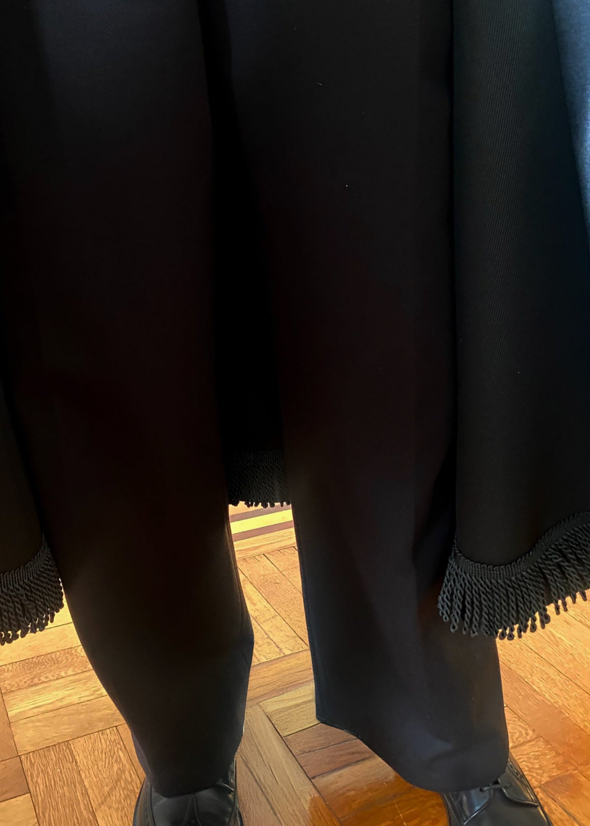 Stacy Stewart Smith Night Watchman Faux Persian Lamb Coat in Coal Black, shown on mannequin at 6'3