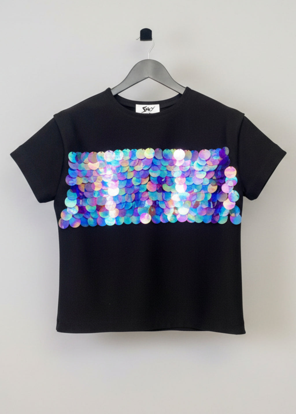 Stacy Stewart Smith Men's Dragon Scales Flange T-Shirt front view on a hanger with gray background. 